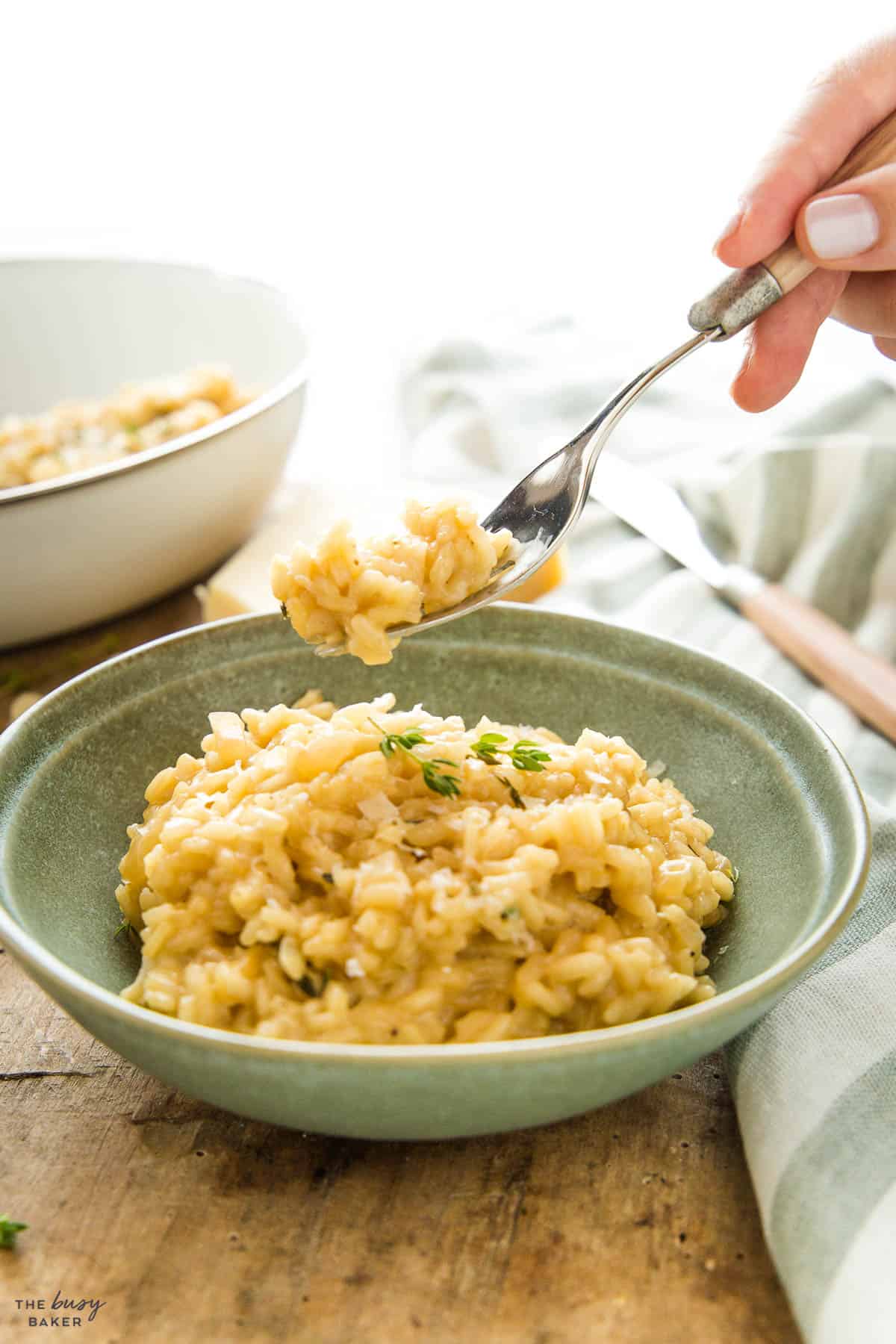 hand holding a fork with homemade risotto