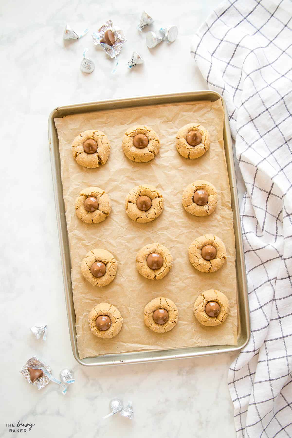 baking pan with peanut butter blossom cookies
