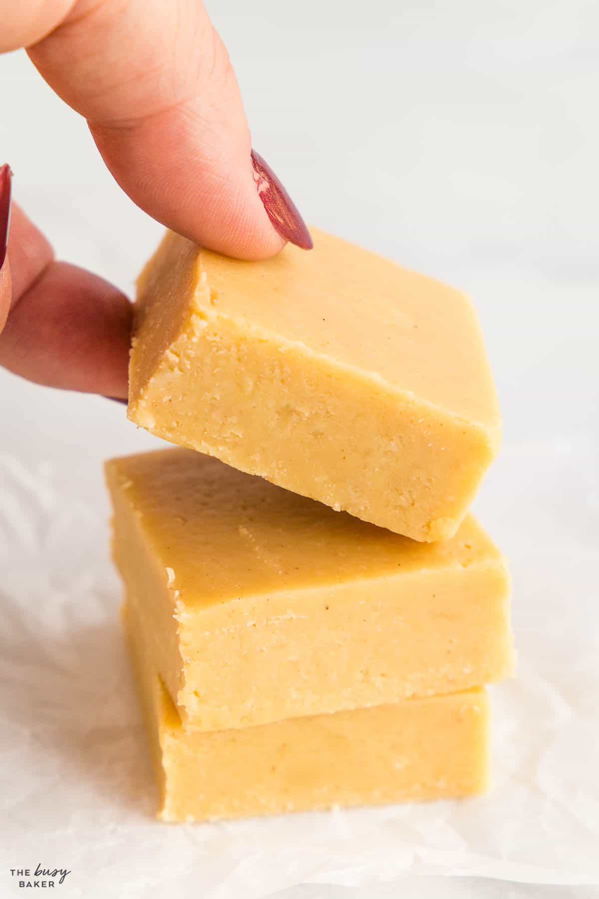 hand grabbing a piece of peanut butter fudge