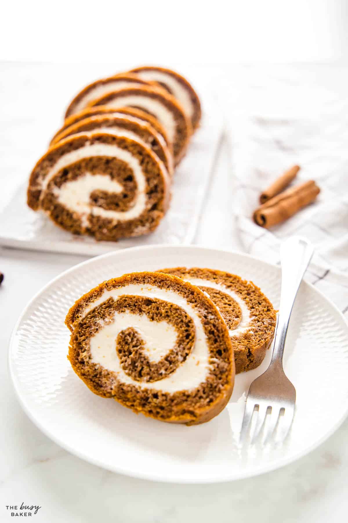 pumpkin roll slices on white plate