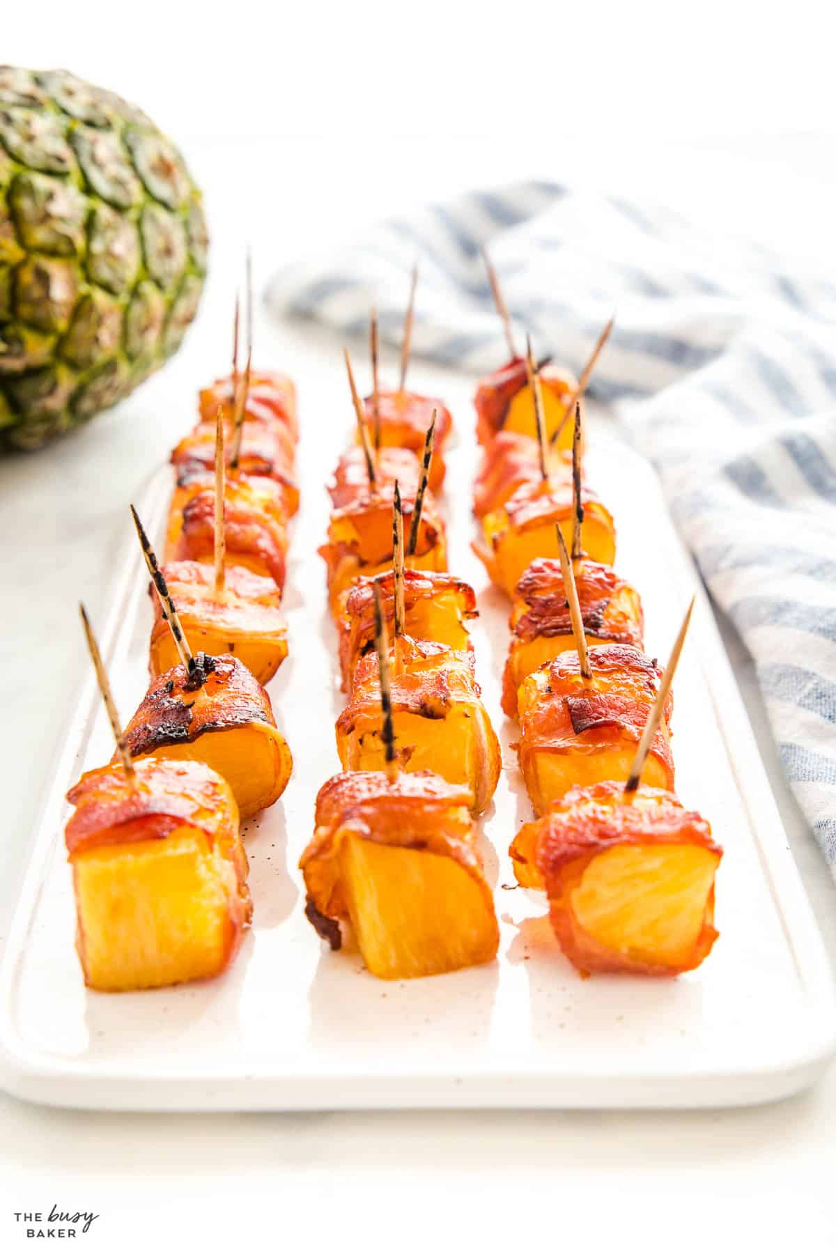 platter of bacon wrapped pineapple bites