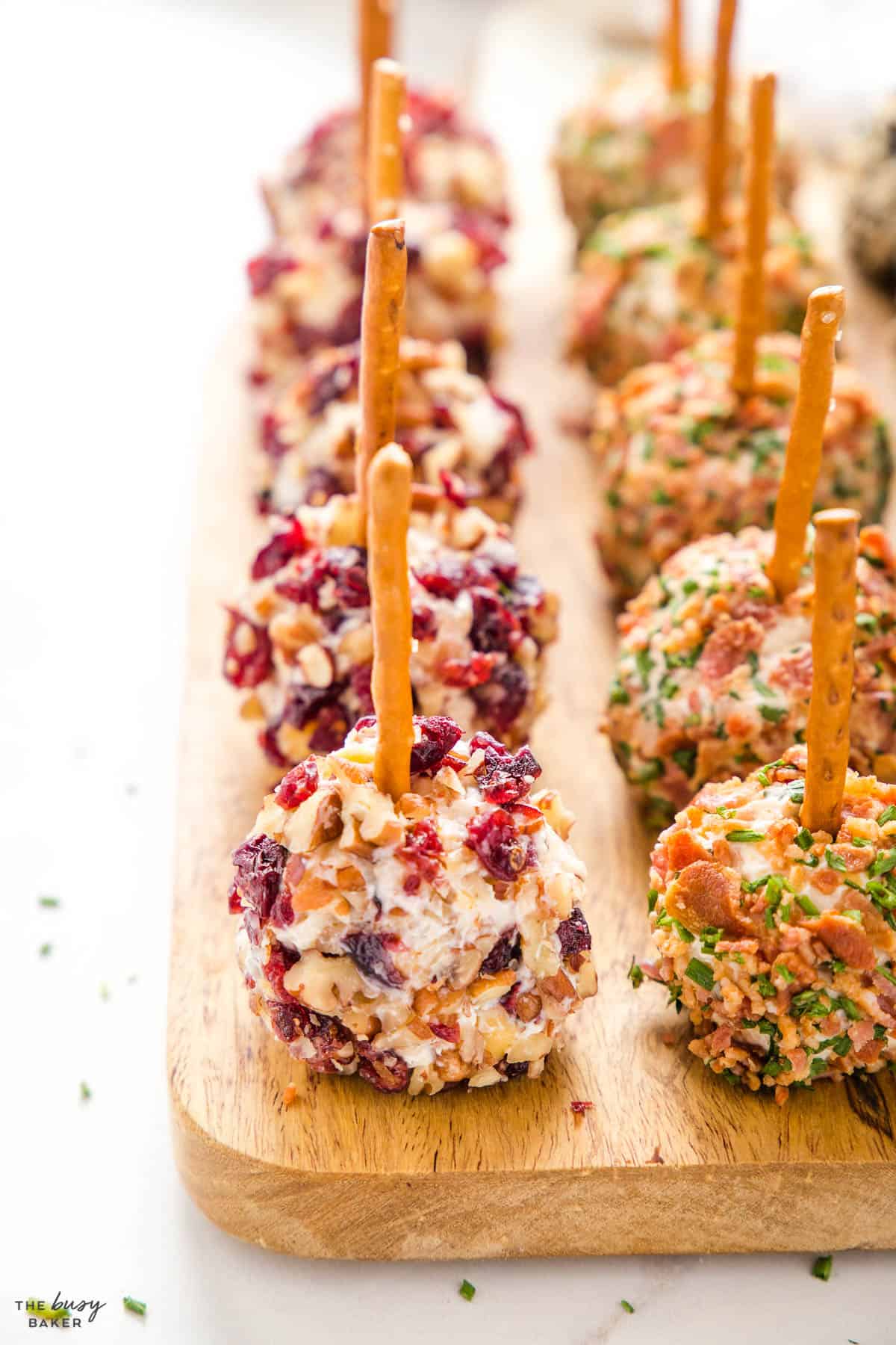 wooden board with mini cheese ball bites