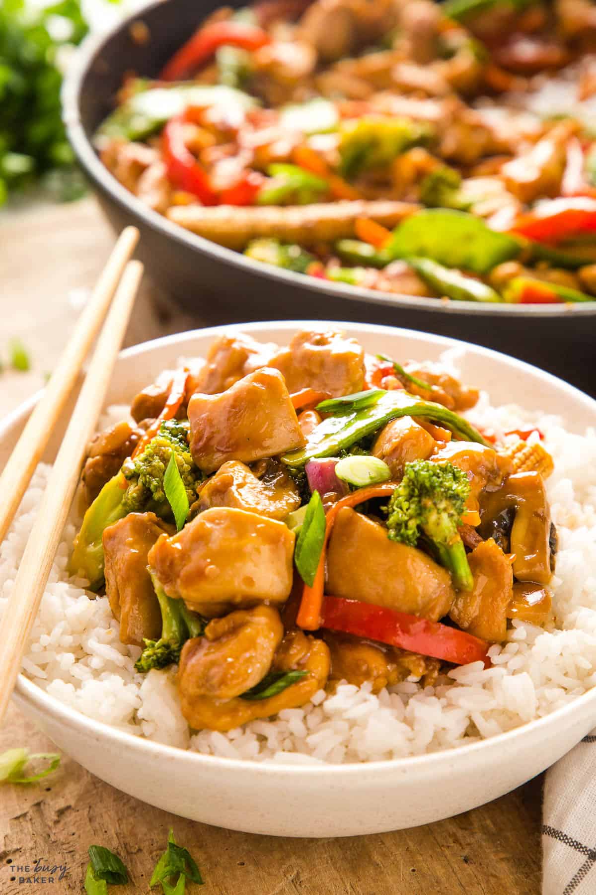chicken stir fry with veggies and rice and sauce