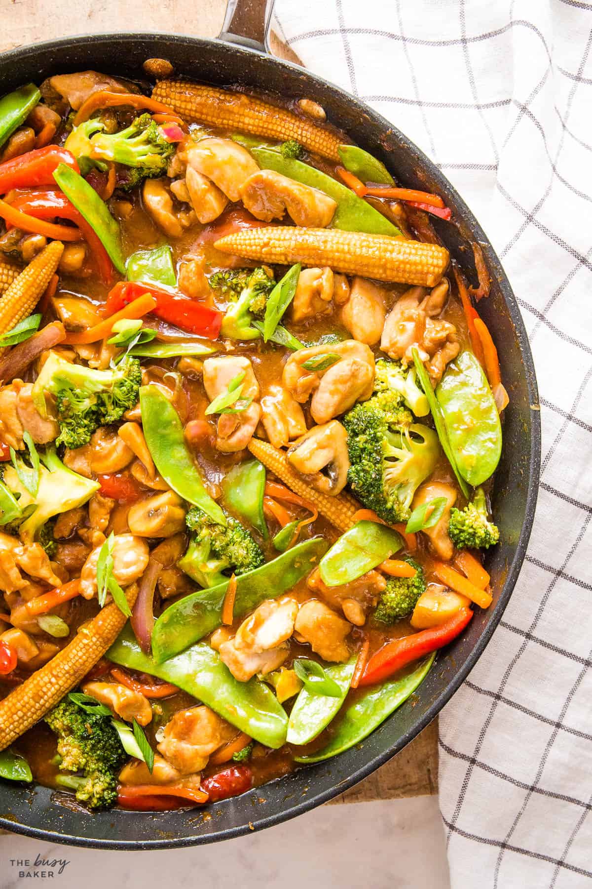 overhead image: stir fry vegetables with chicken and green onions