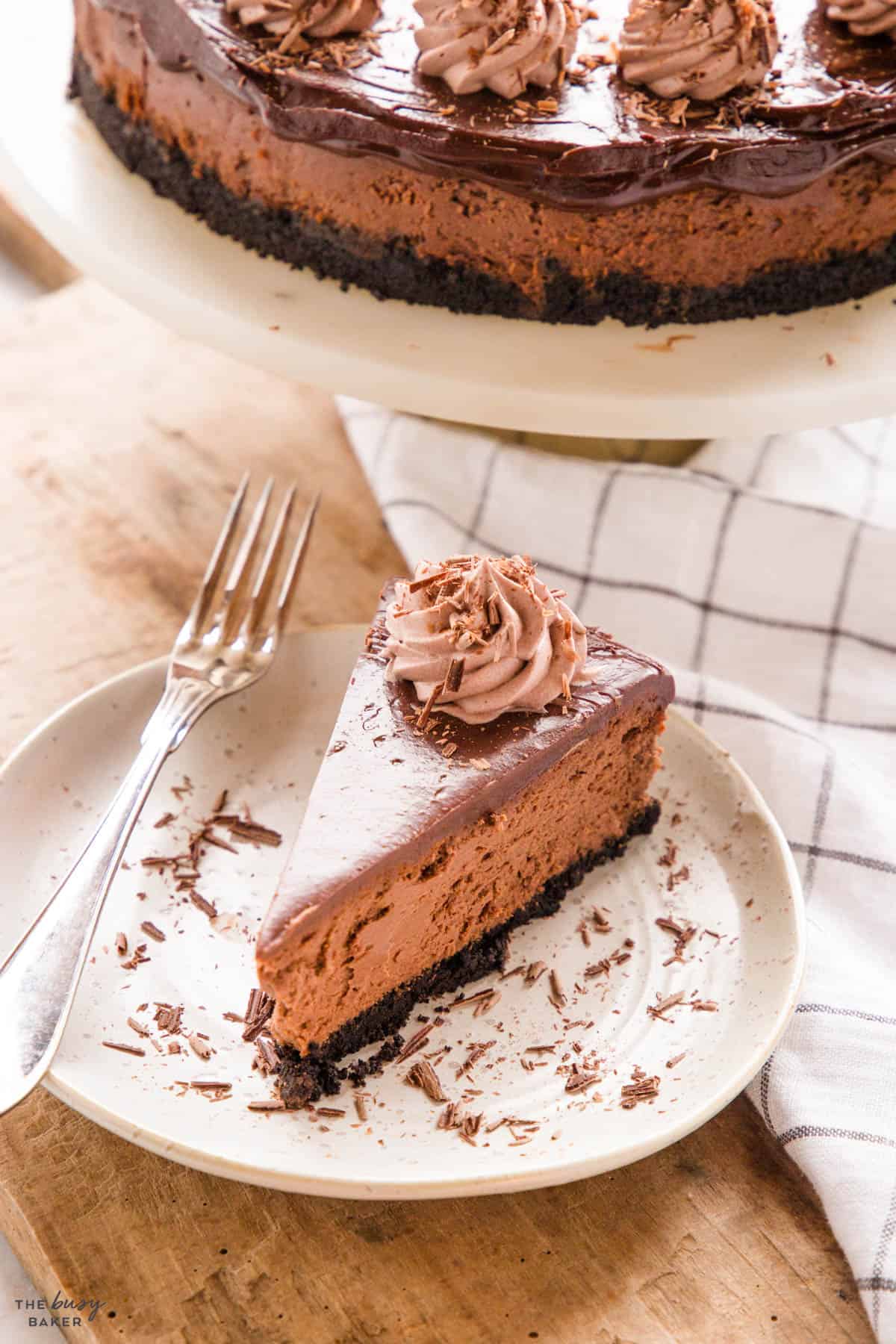 slice of chocolate baked cheesecake with chocolate ganache
