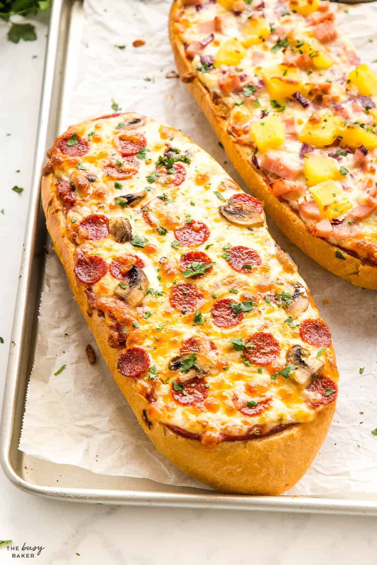 loaf of french bread with pepperoni, mushrooms and cheese
