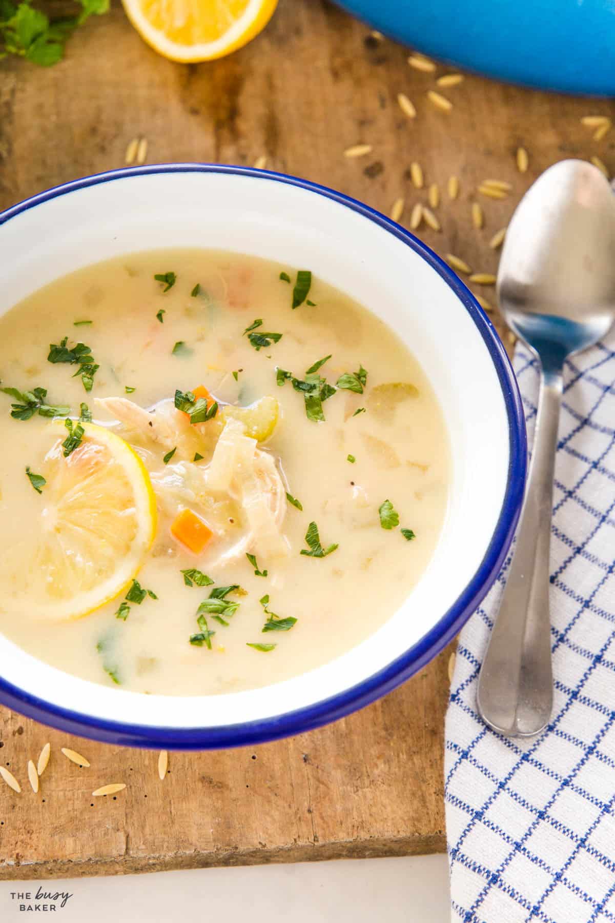 Greek lemon chicken soup in blue and white bowl