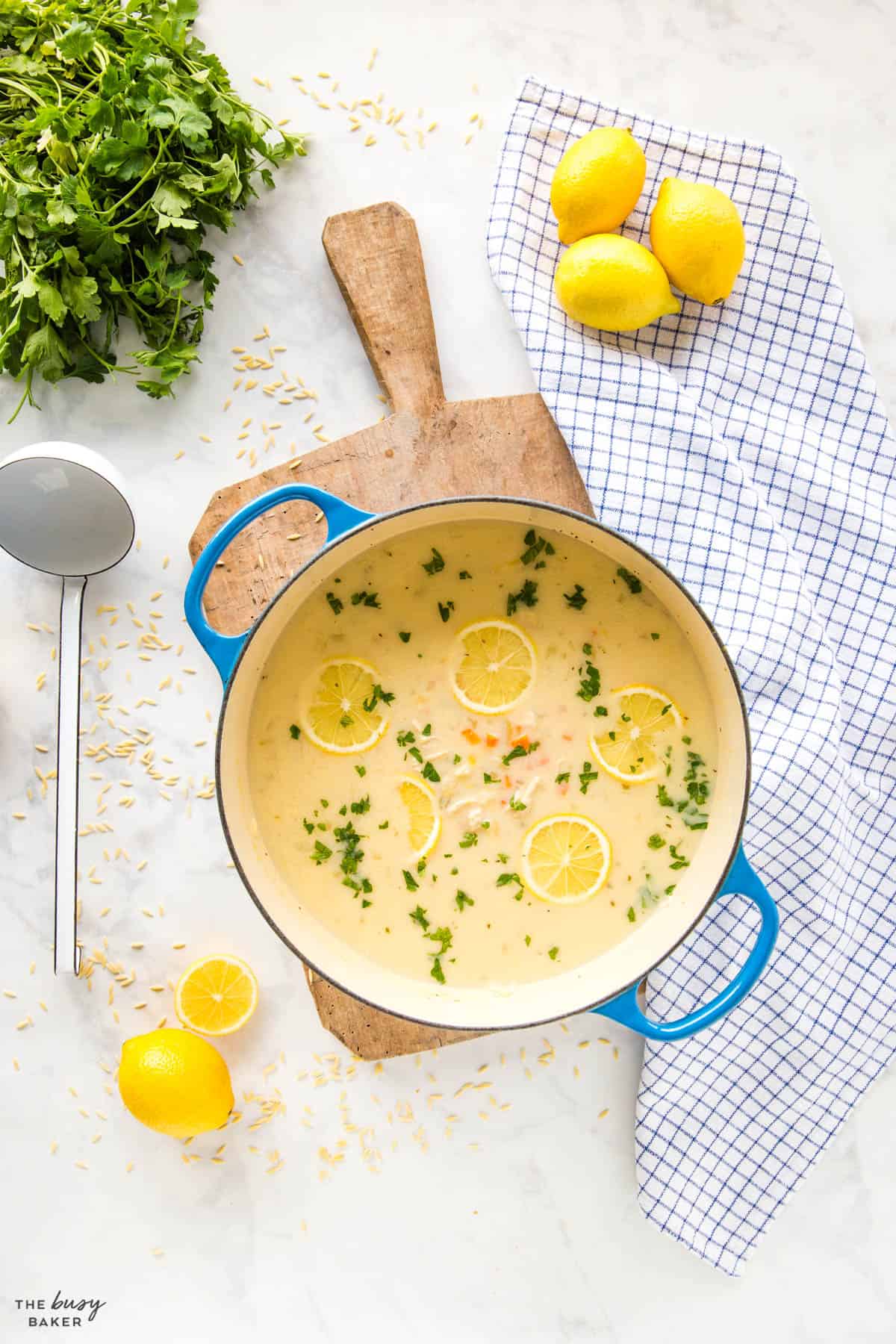 lemon chicken orzo soup in blue pot