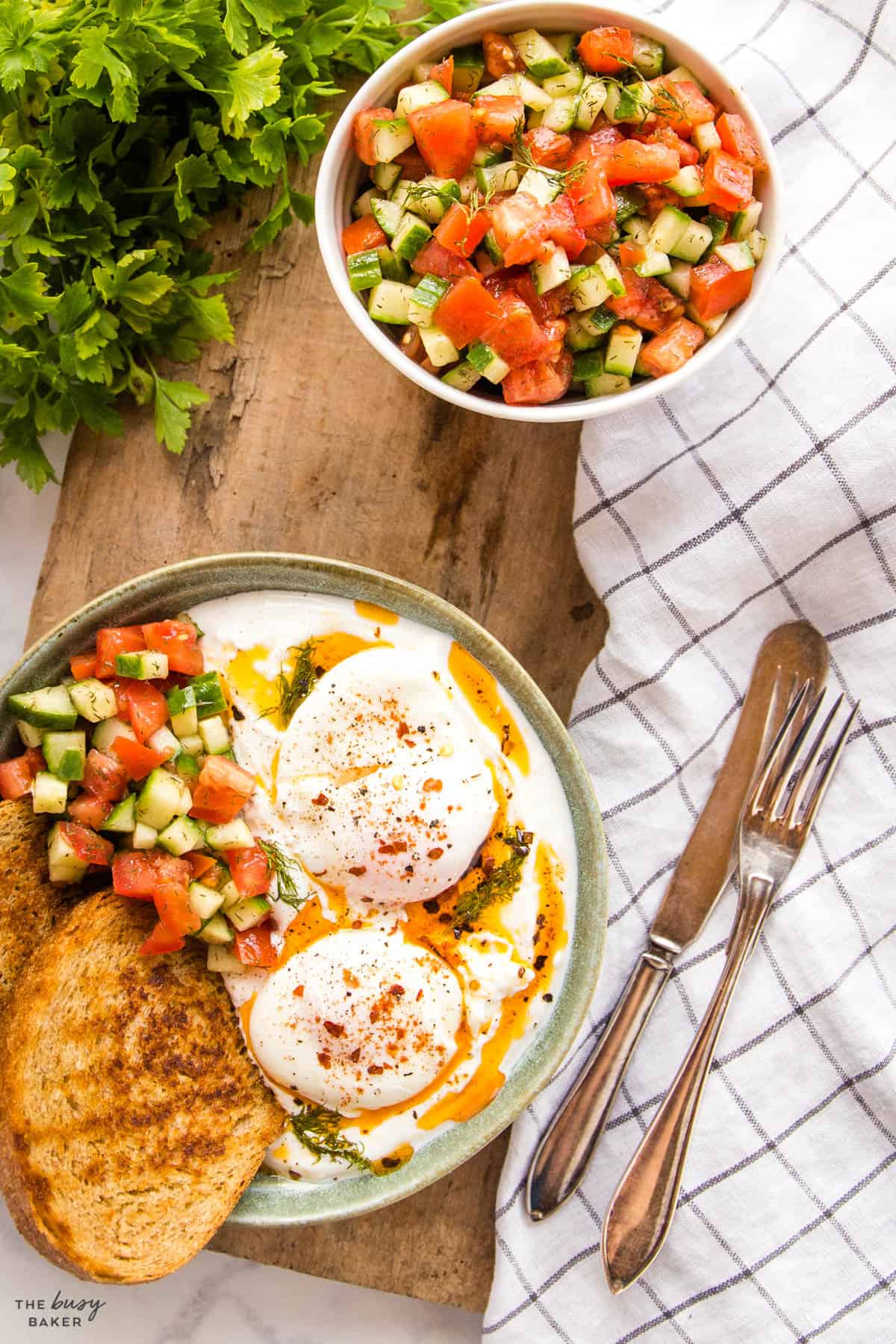 overhead image: Turkish Eggs with salad and toast