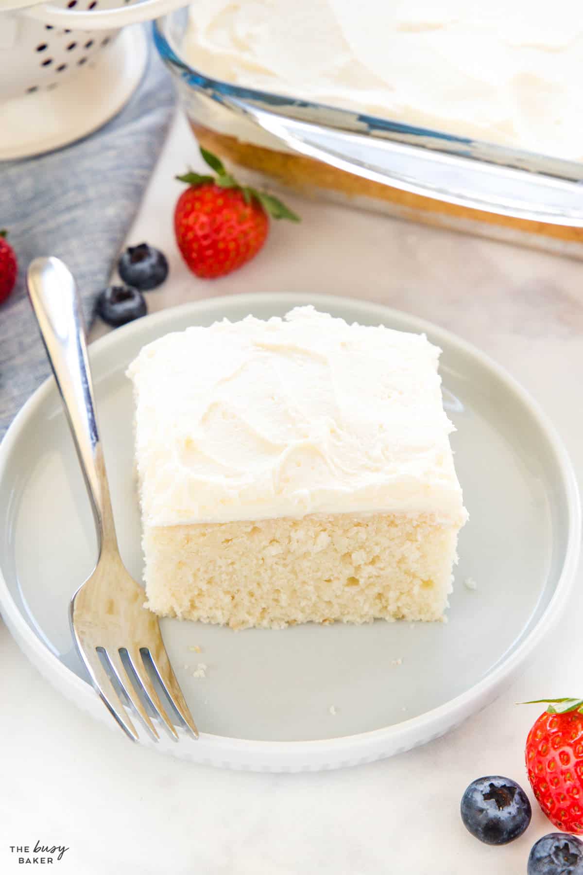  slice of white cake on a plate with a fork