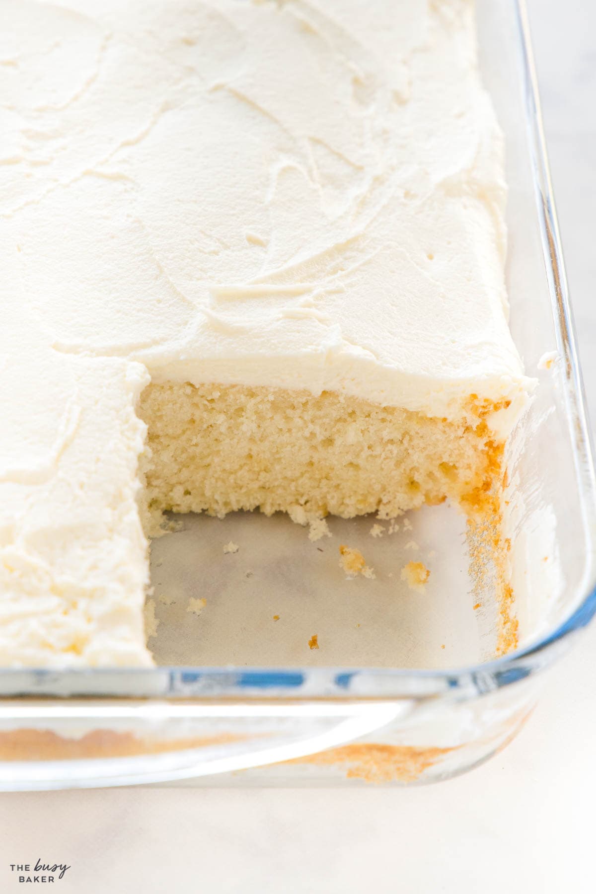 white cake in a glass pan
