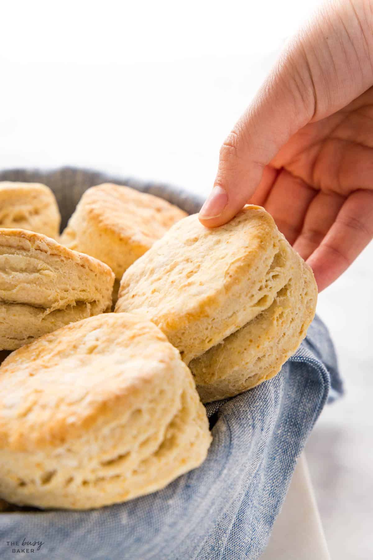 hand reaching for a homemade biscuit