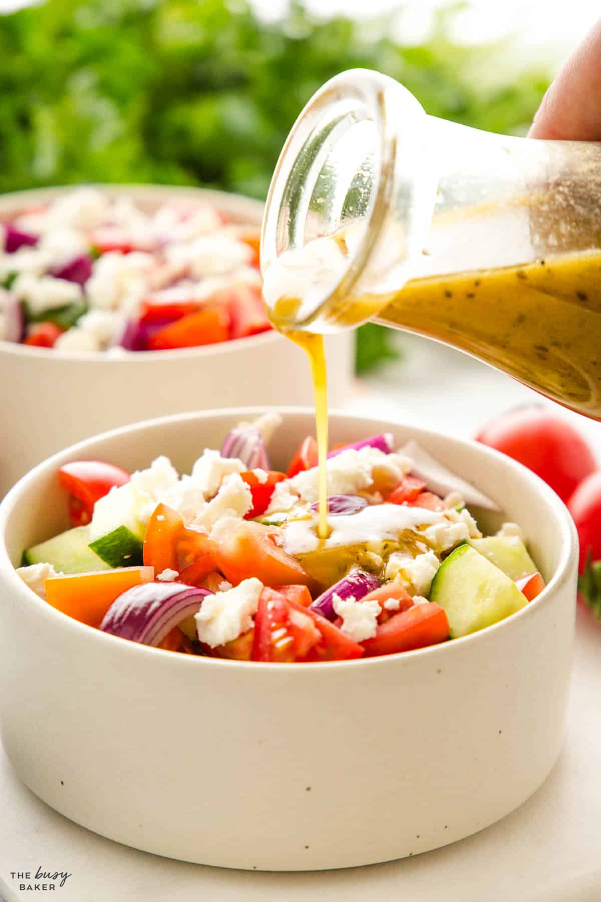 vinaigrette salad dressing over Greek salad