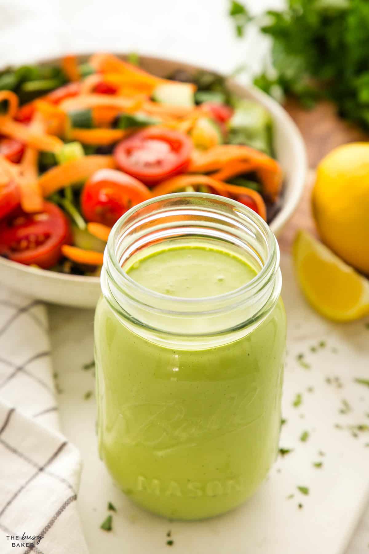 mason jar with herb-infused sauce