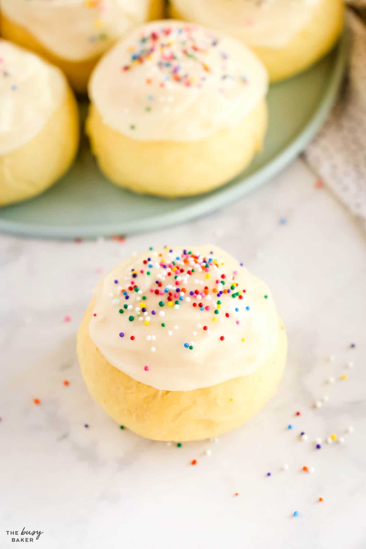 paska bun with frosting and sprinkles
