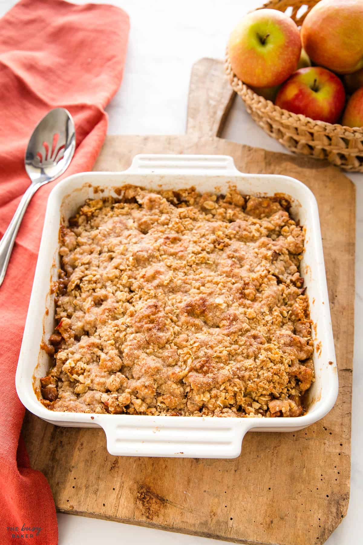 apple crisp in a white baking dish