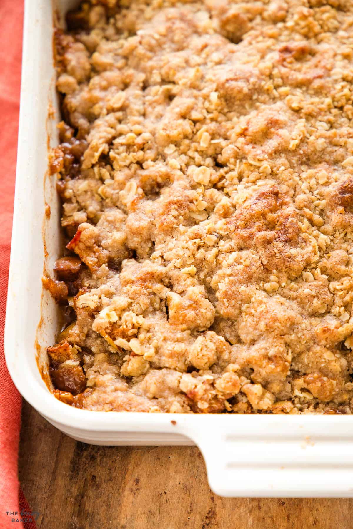 apple crisp in a white baking dish