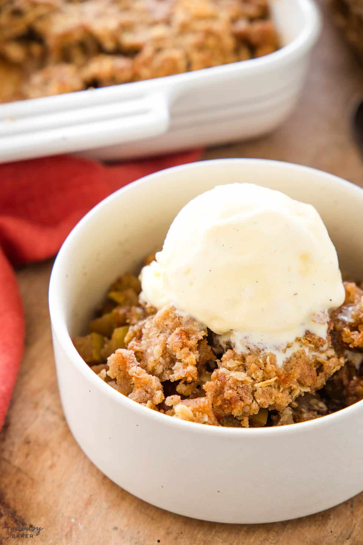 apple crisp with a scoop of vanilla ice cream on top