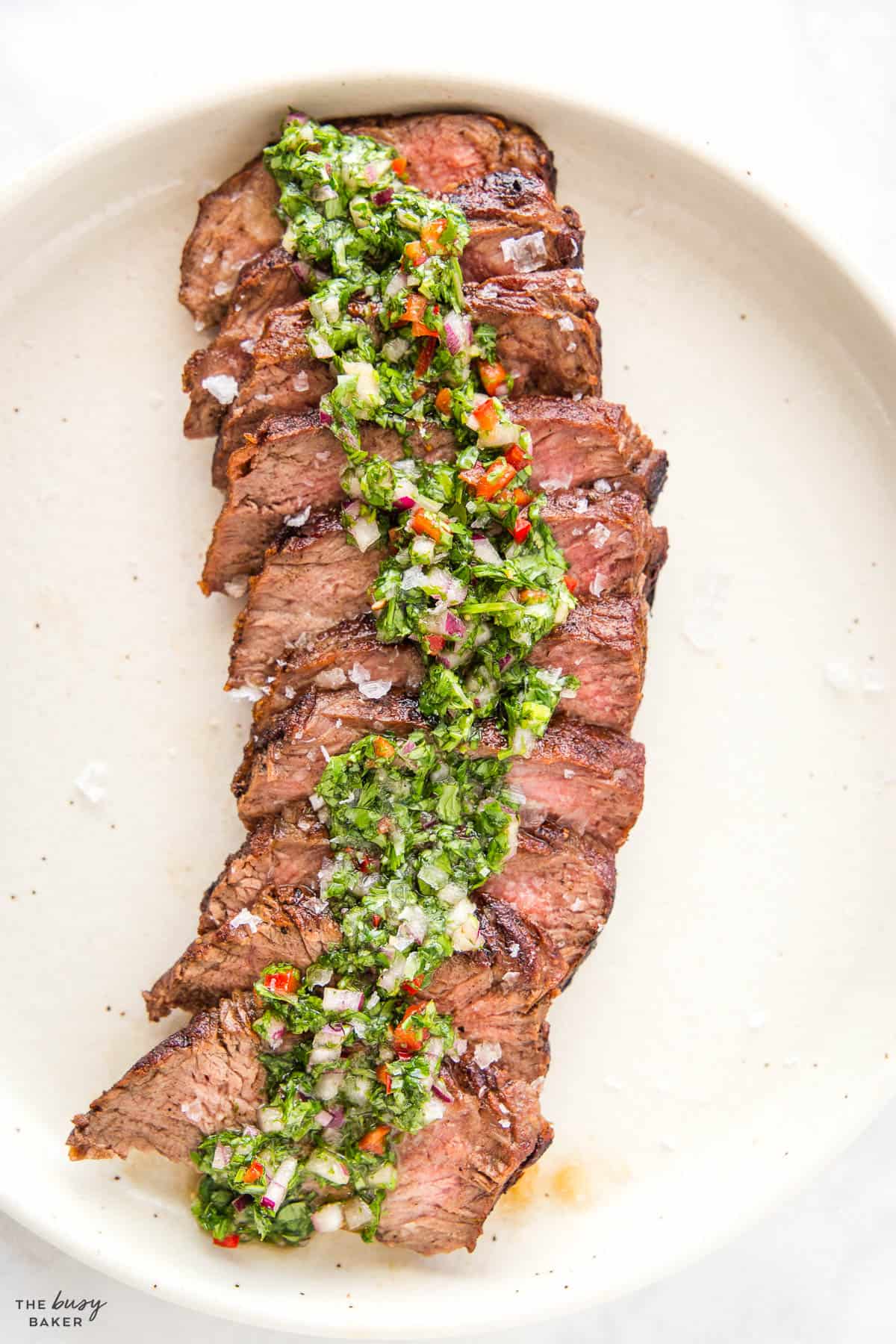 medium rare steak with chimichurri sauce