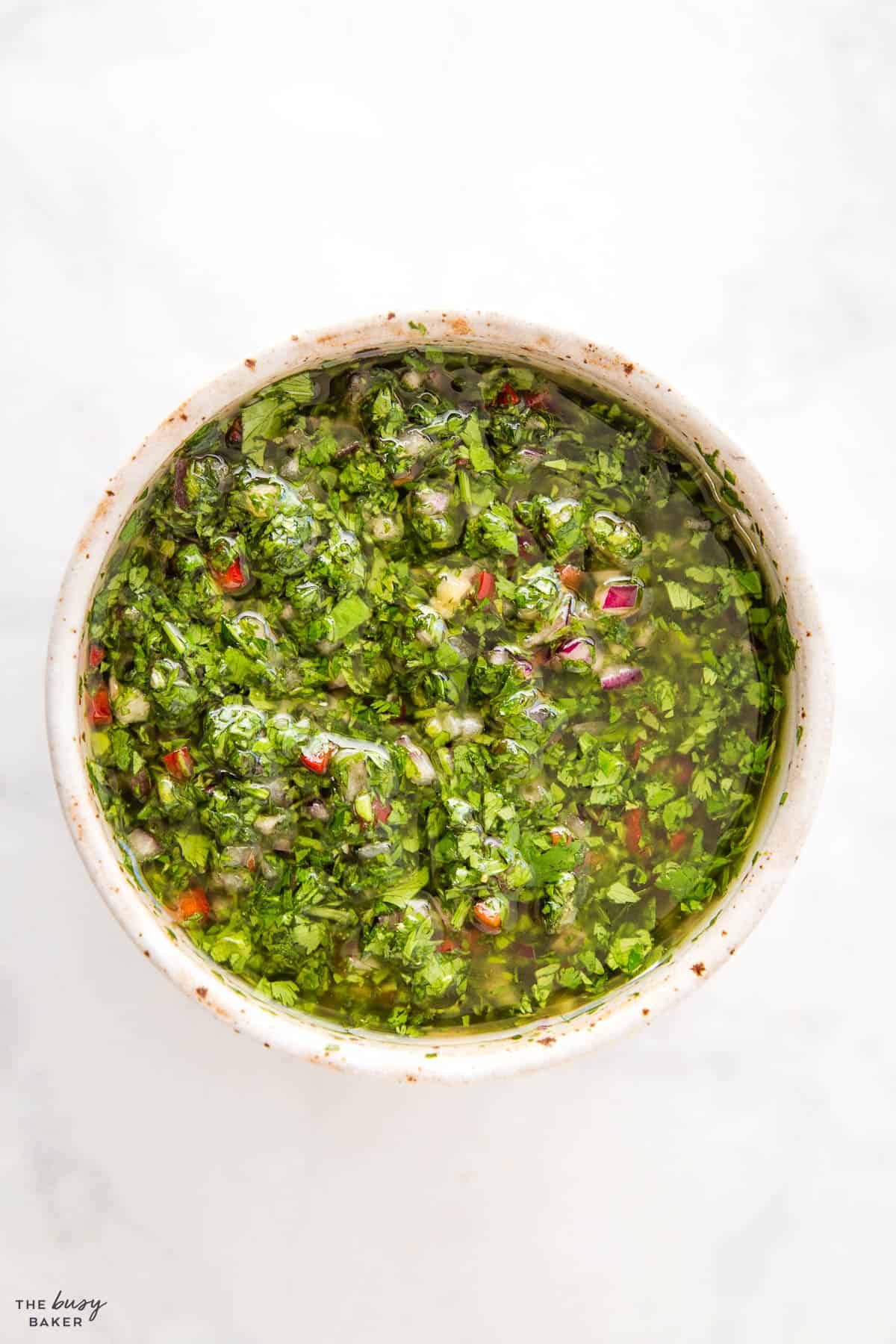 overhead image: chimichurri in a pottery bowl