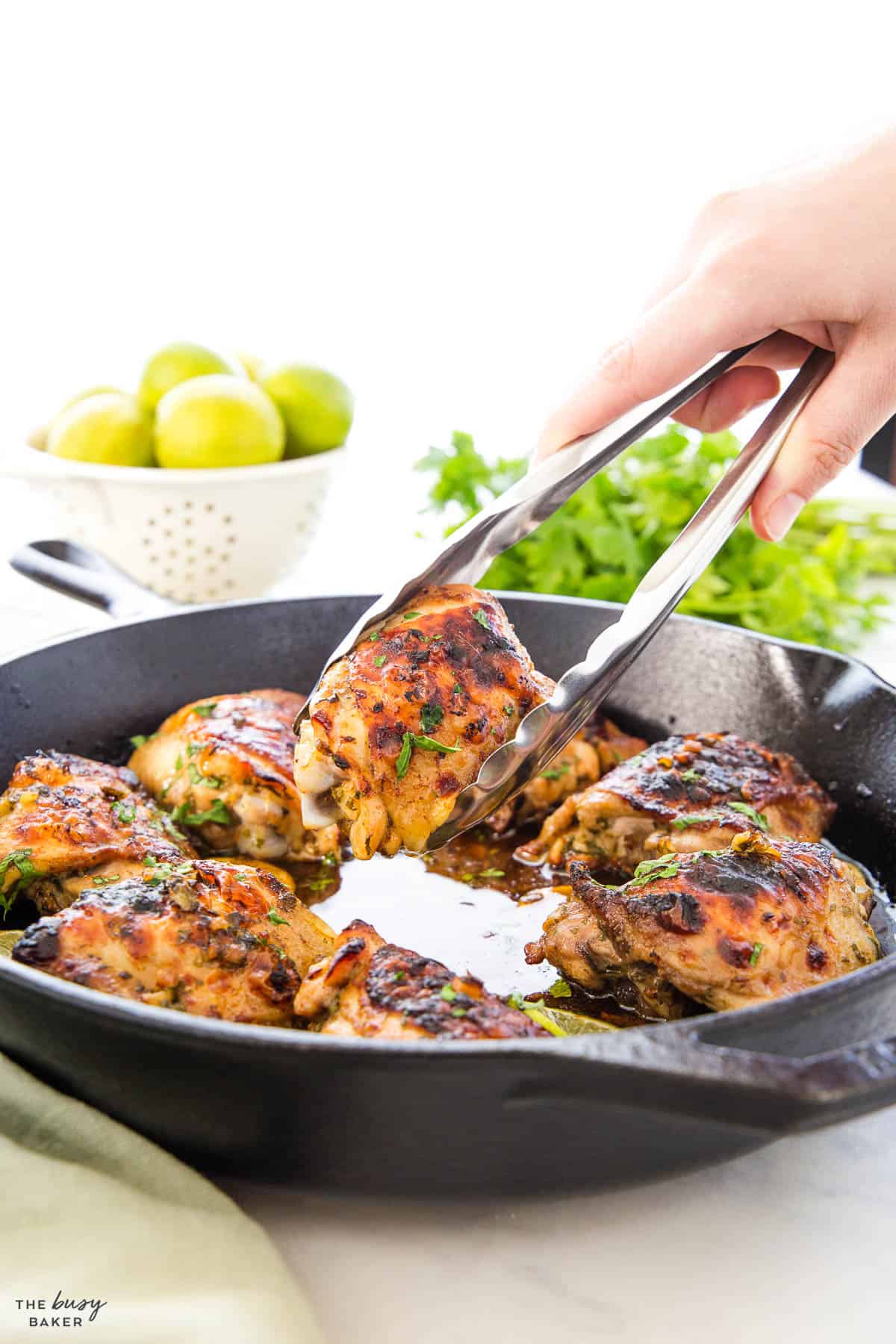 meat and herbs in a cast iron skillet