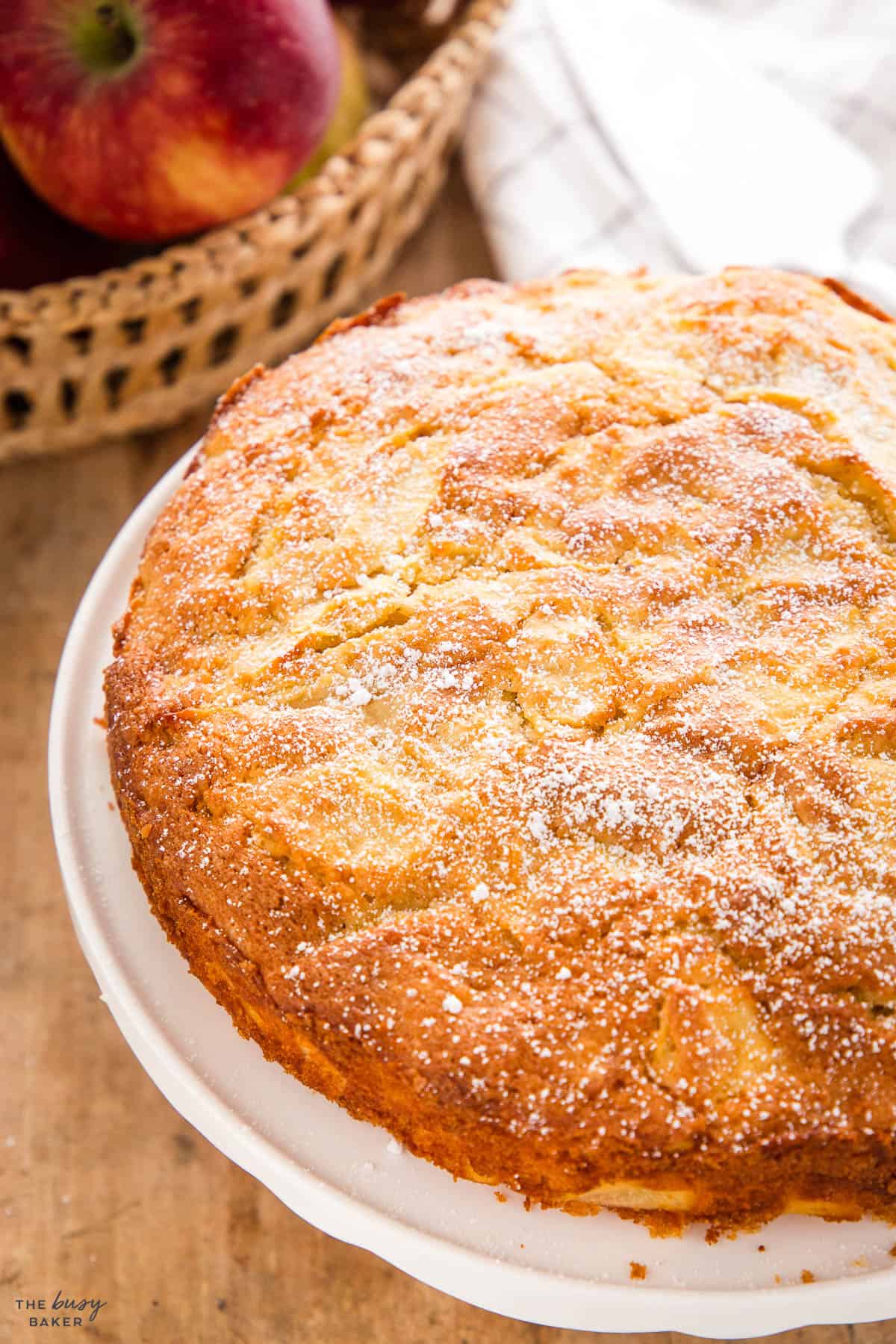 French Apple Cake on a white cake stand