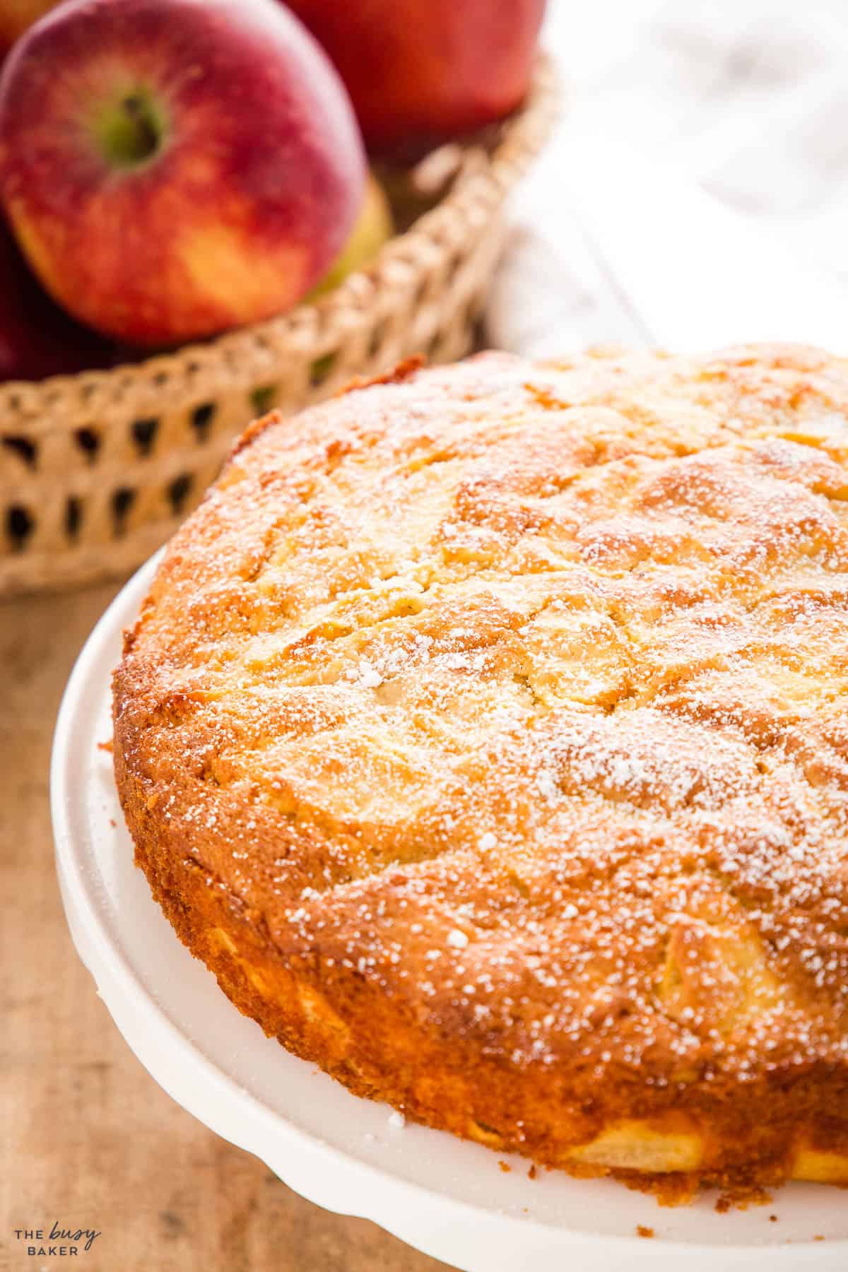 French Apple Cake on a white cake stand