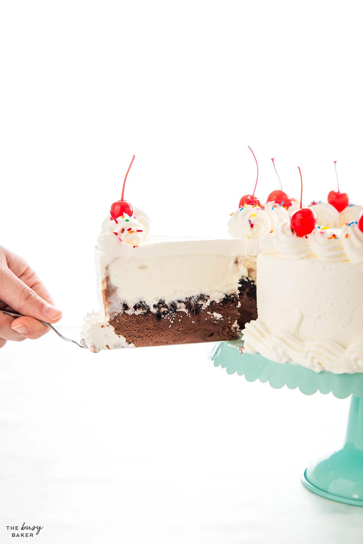 hand serving a slice of copycat Dairy Queen ice cream cake