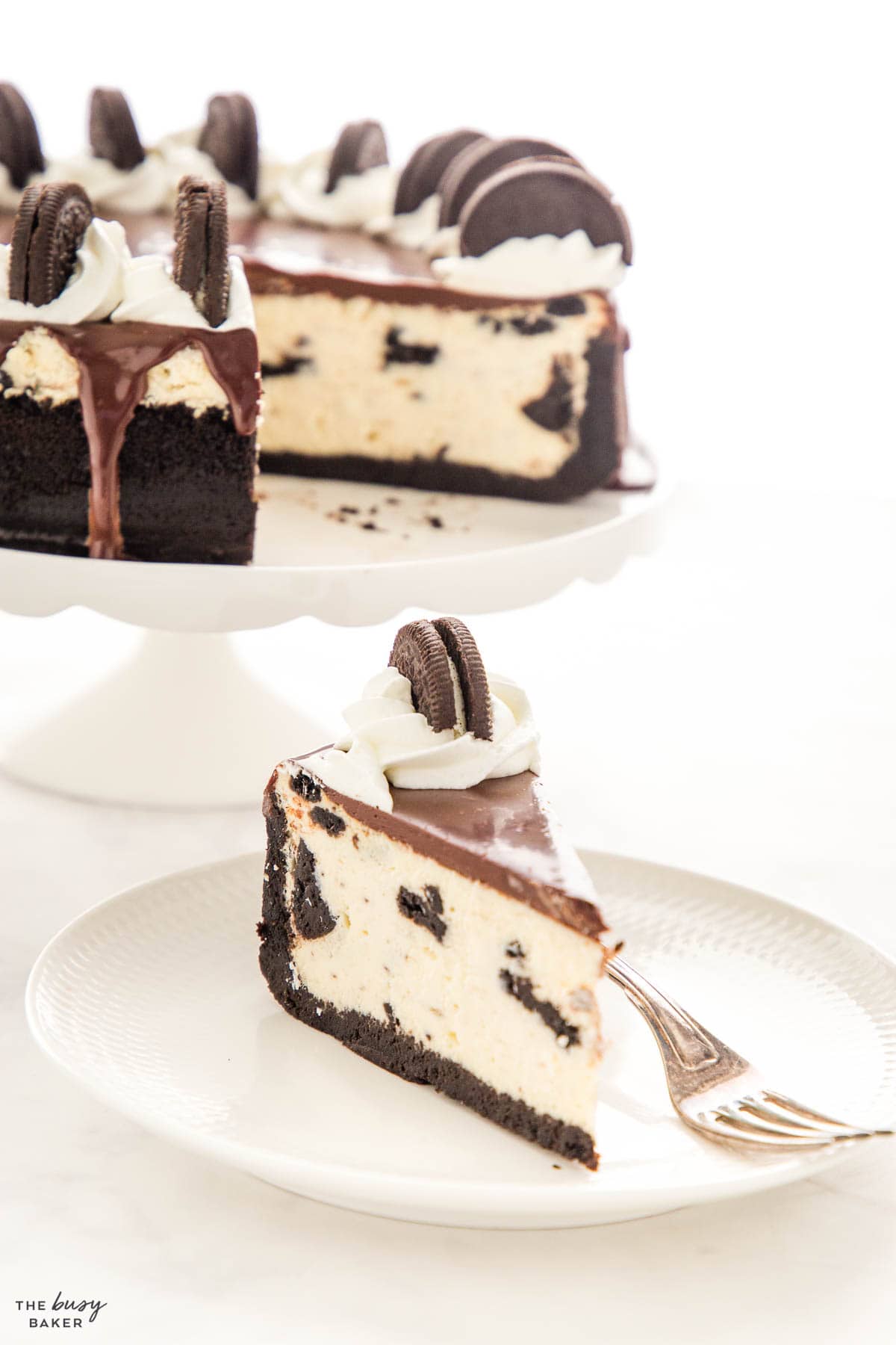 creamy dessert on a white plate with a vintage fork