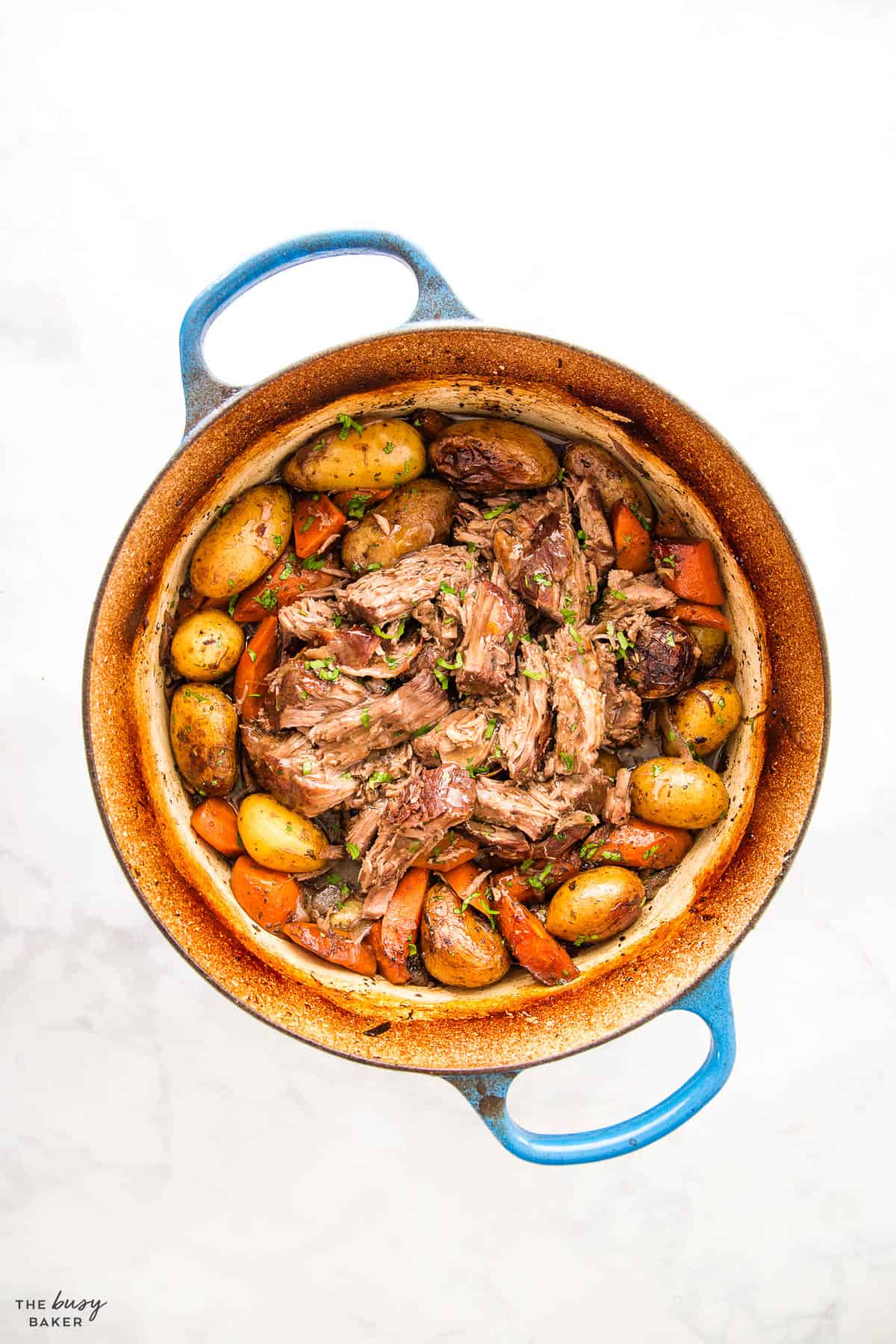 oven roasted pot roast in a blue pot