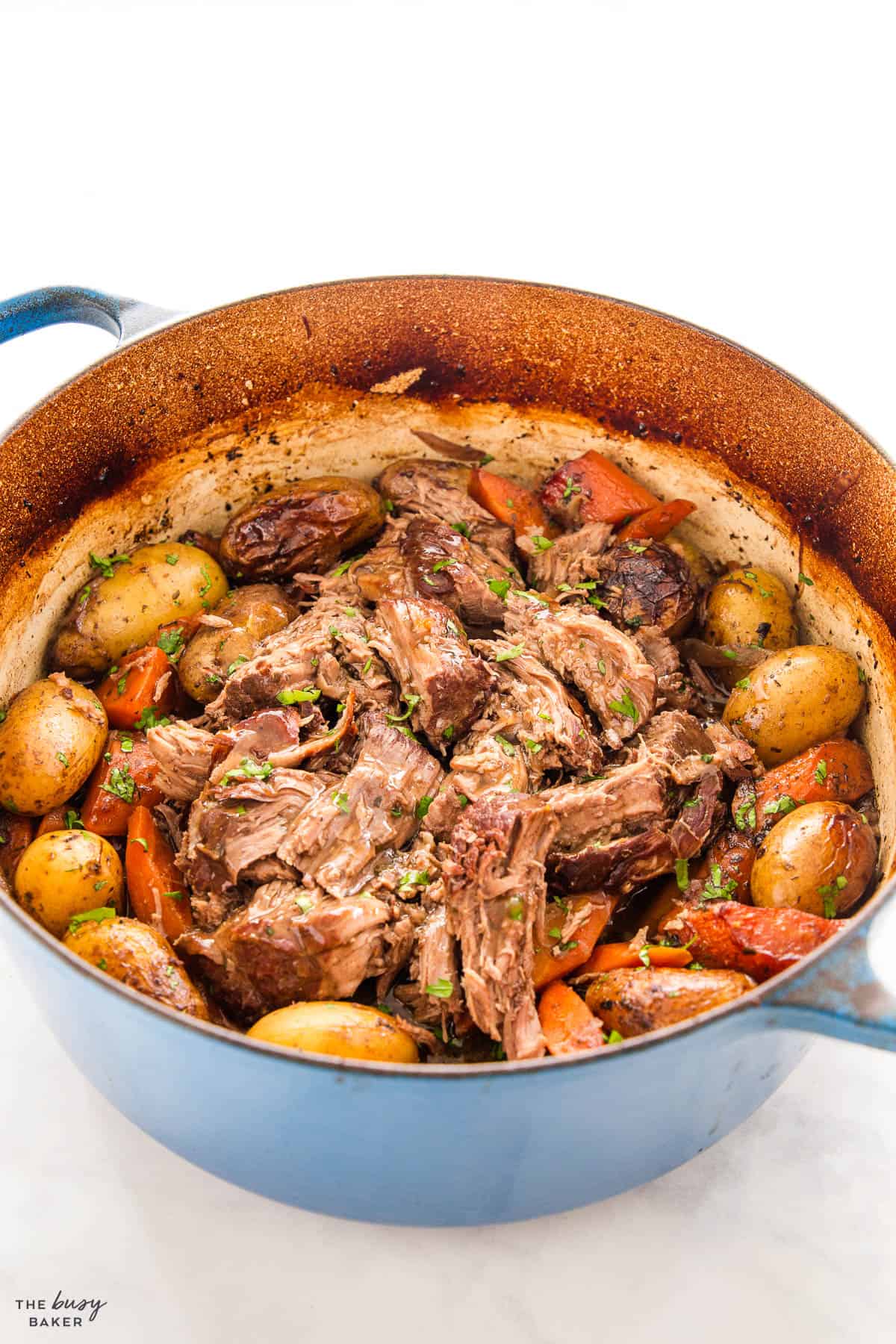 juicy pot roast with gravy, carrots and potatoes