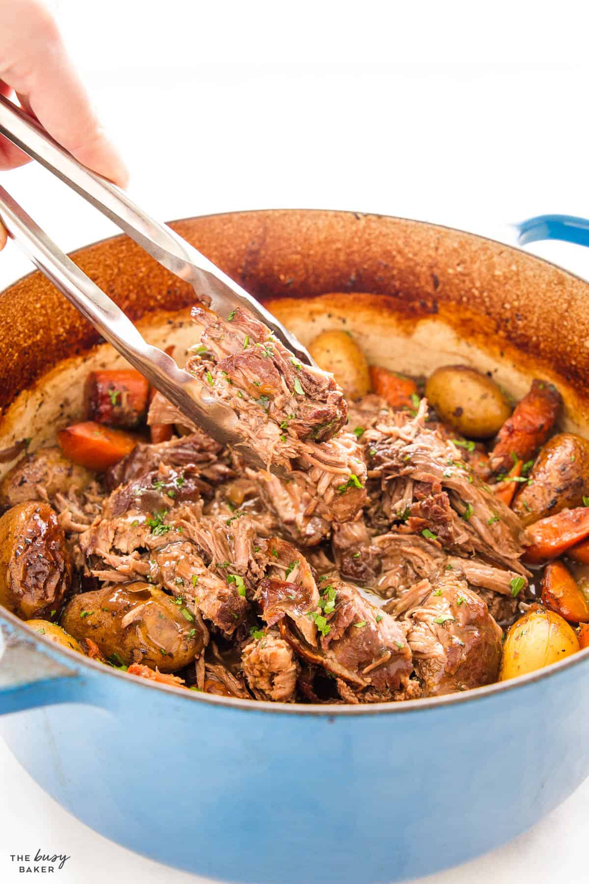 tongs serving pot roast