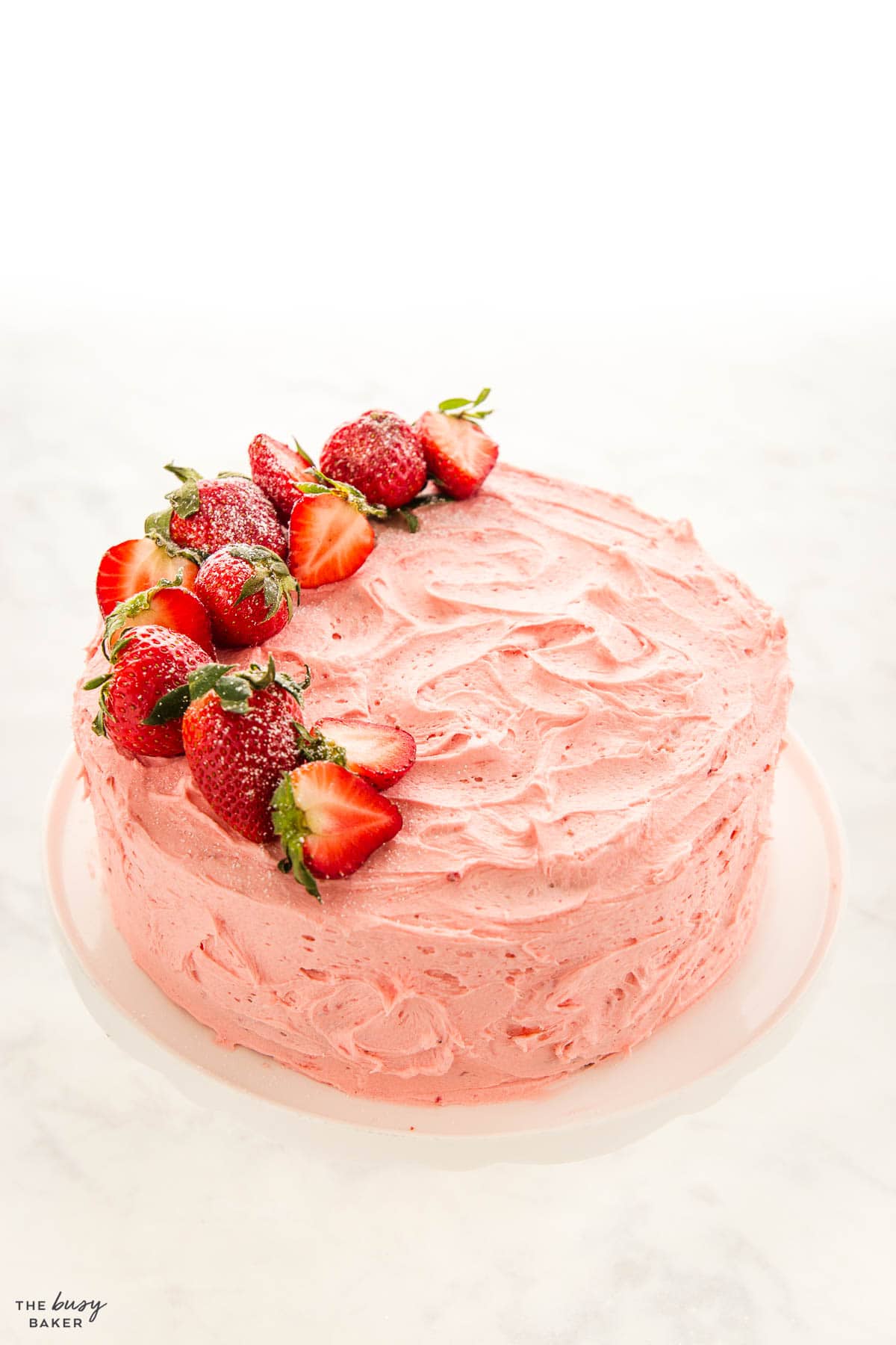 strawberry layer cake frosted with fresh strawberry buttercream