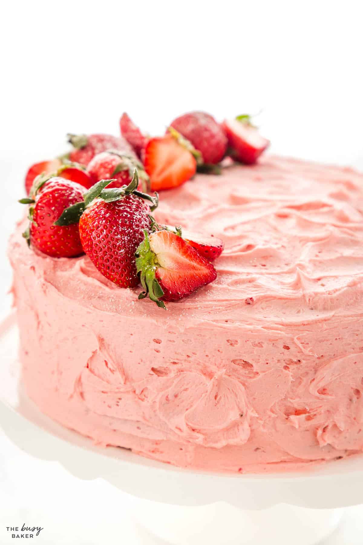 strawberry layer cake with fresh strawberries on top