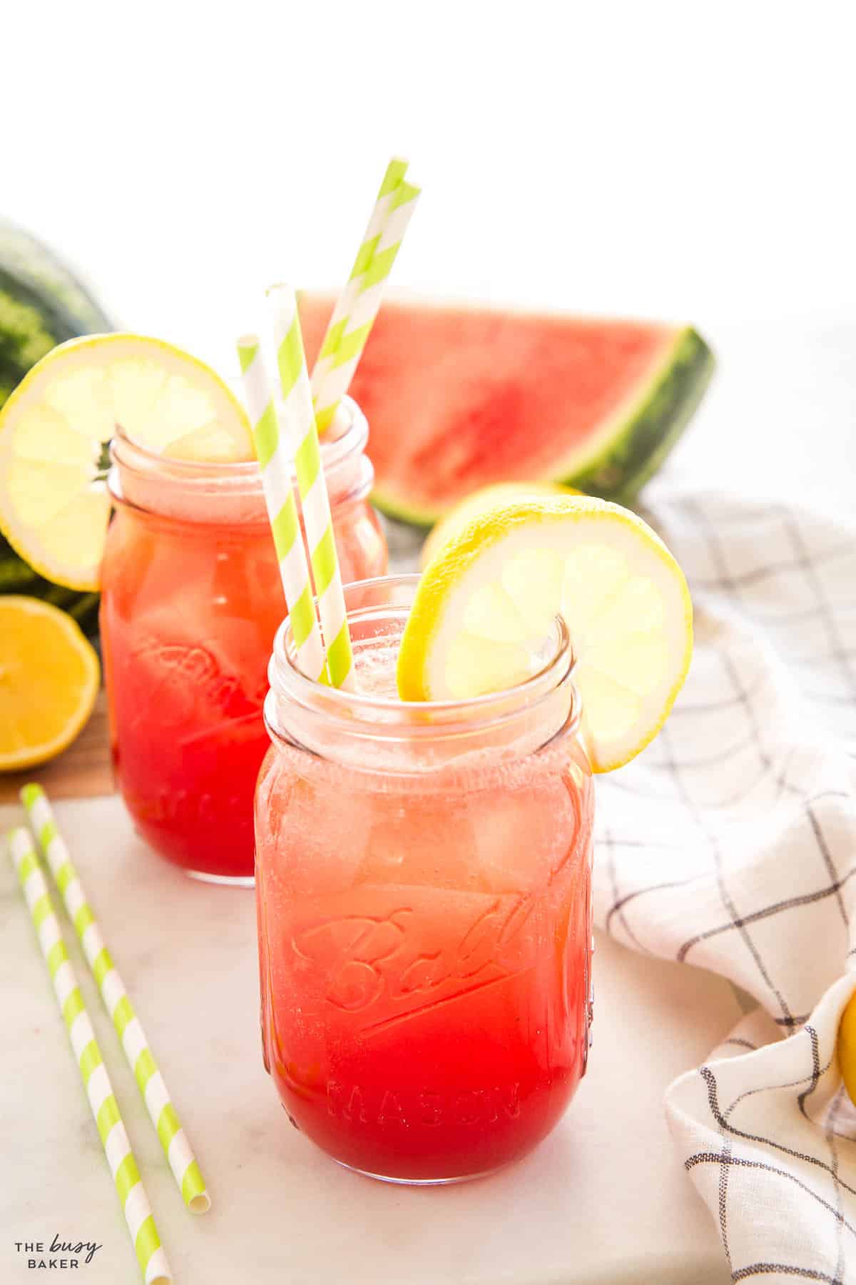 watermelon lemonade in a mason jar with a straw