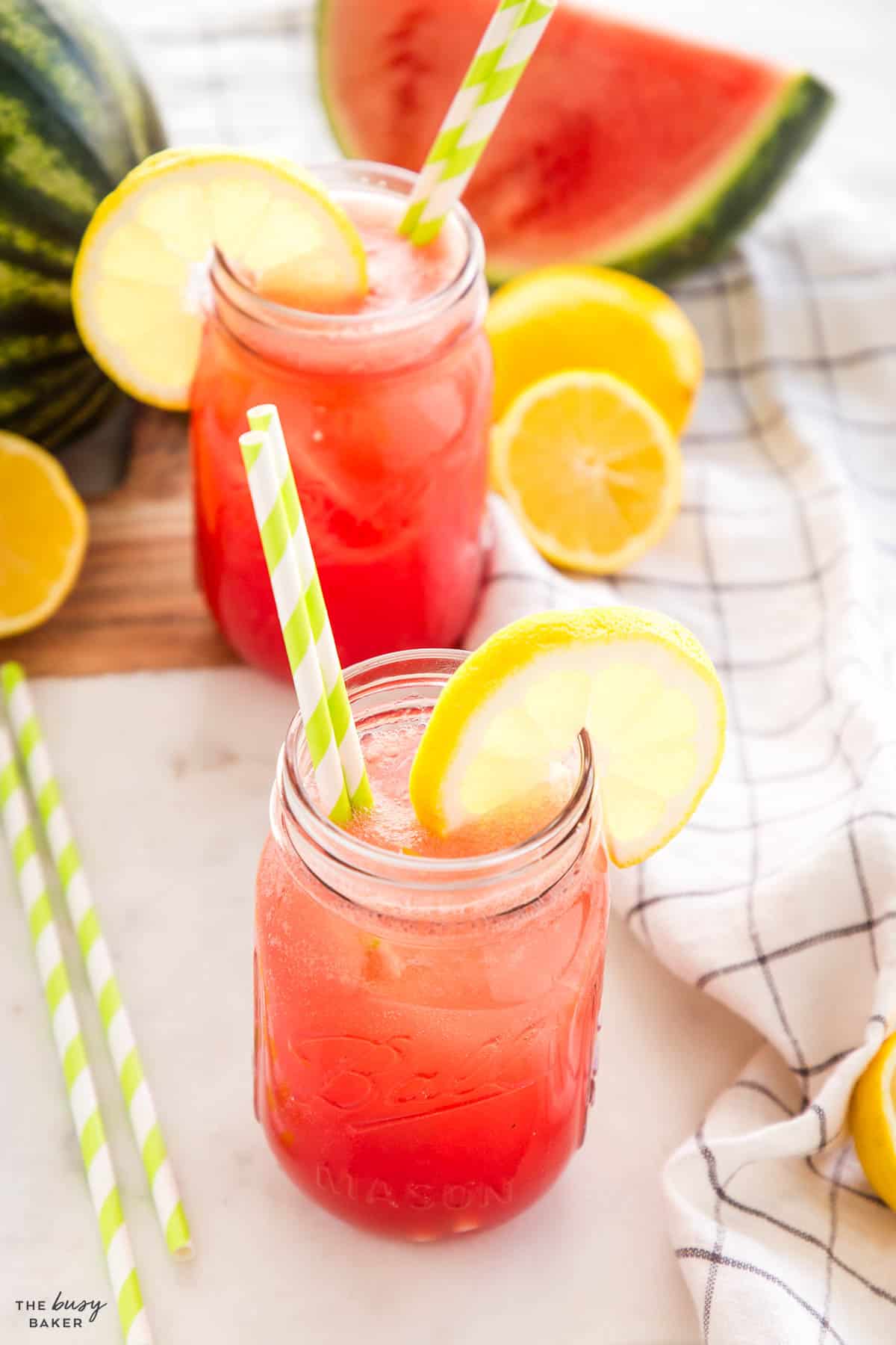 summer drink in a mason jar with paper straws