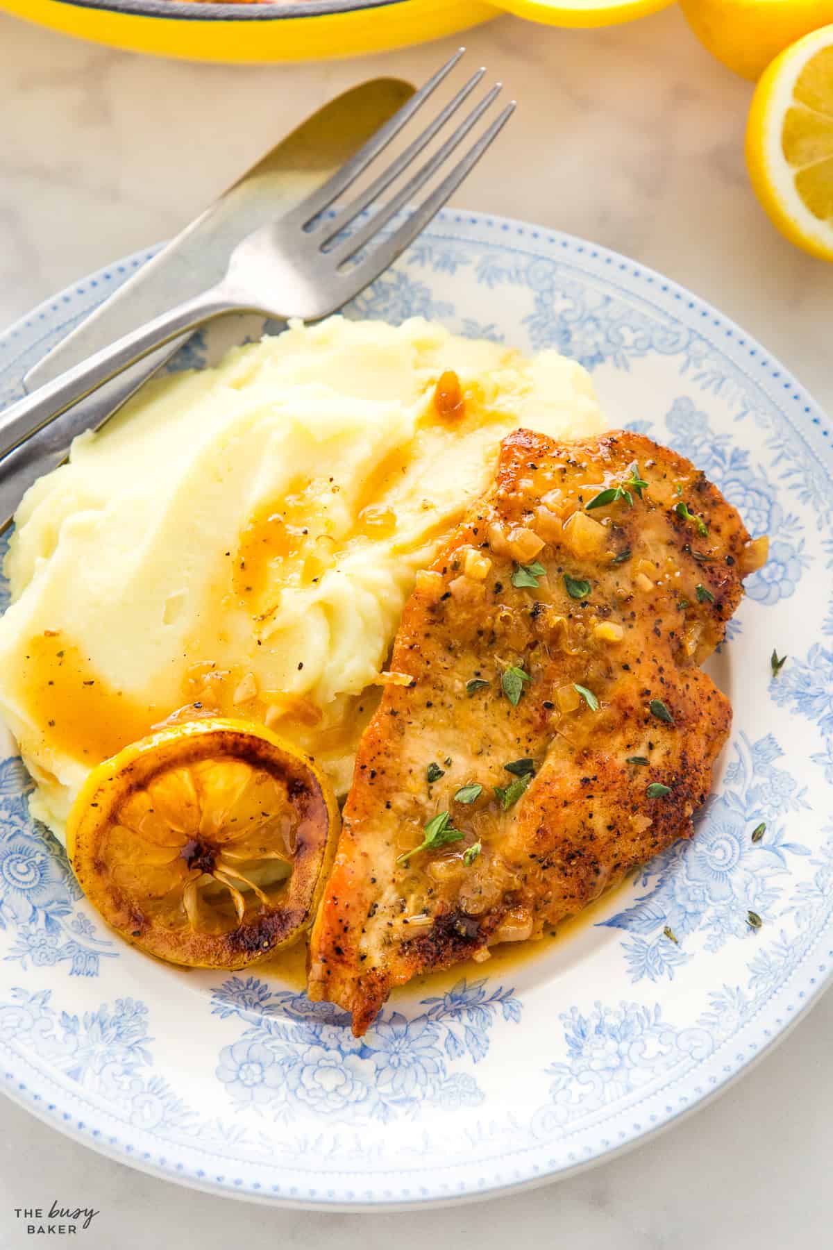 lemon chicken with mashed potatoes on plate