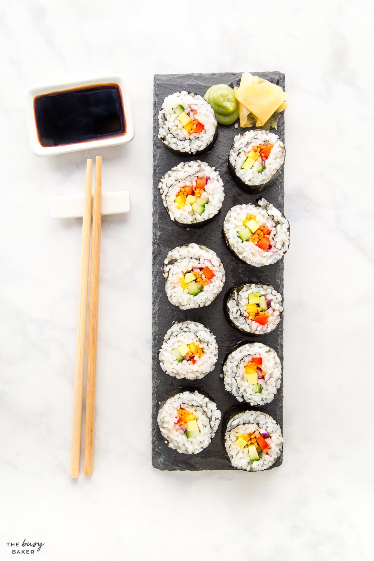 Japanese takeout with soy sauce and chopsticks, ginger and wasabi