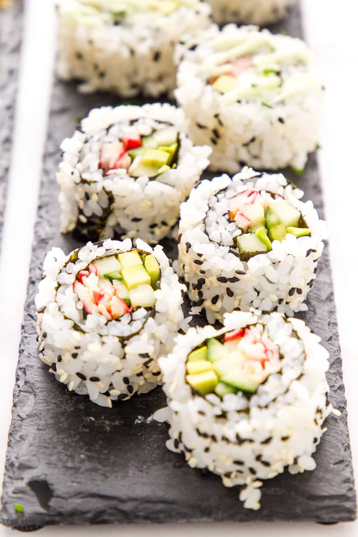 sushi roll with rice and sesame seeds