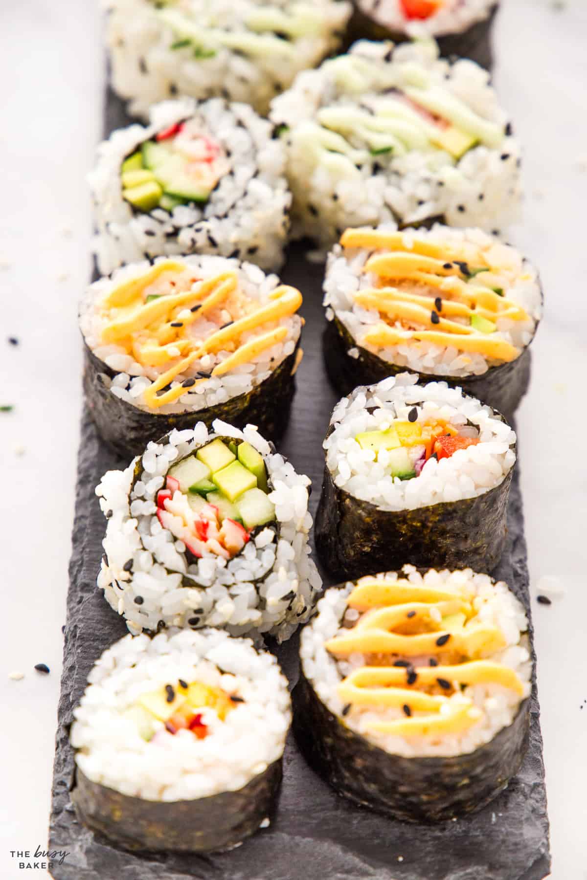 sushi rolls on a slate board