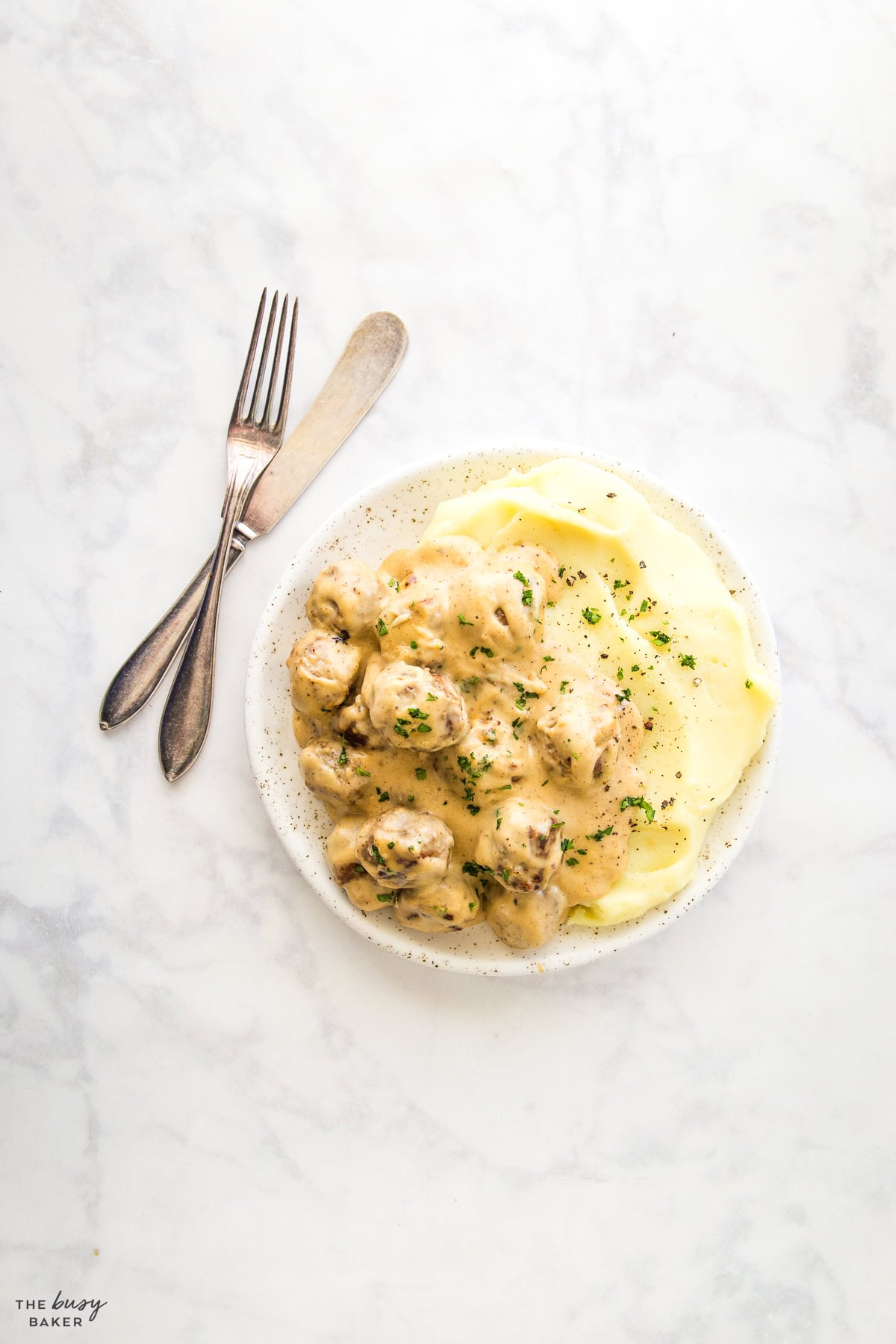 overhead image: swedish meatballs with a creamy gravy and mashed potatoes