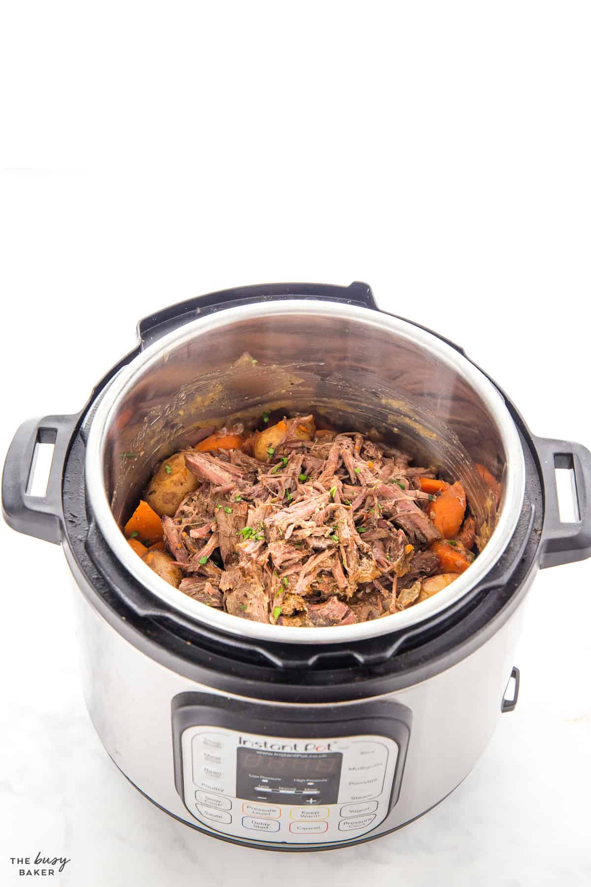 beef pot roast in the instant pot with potatoes and carrots