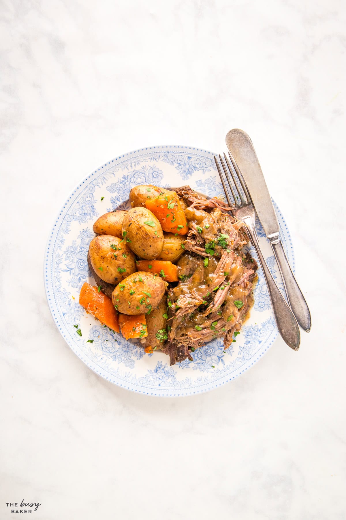 pot roast with potatoes and carrots on a plate