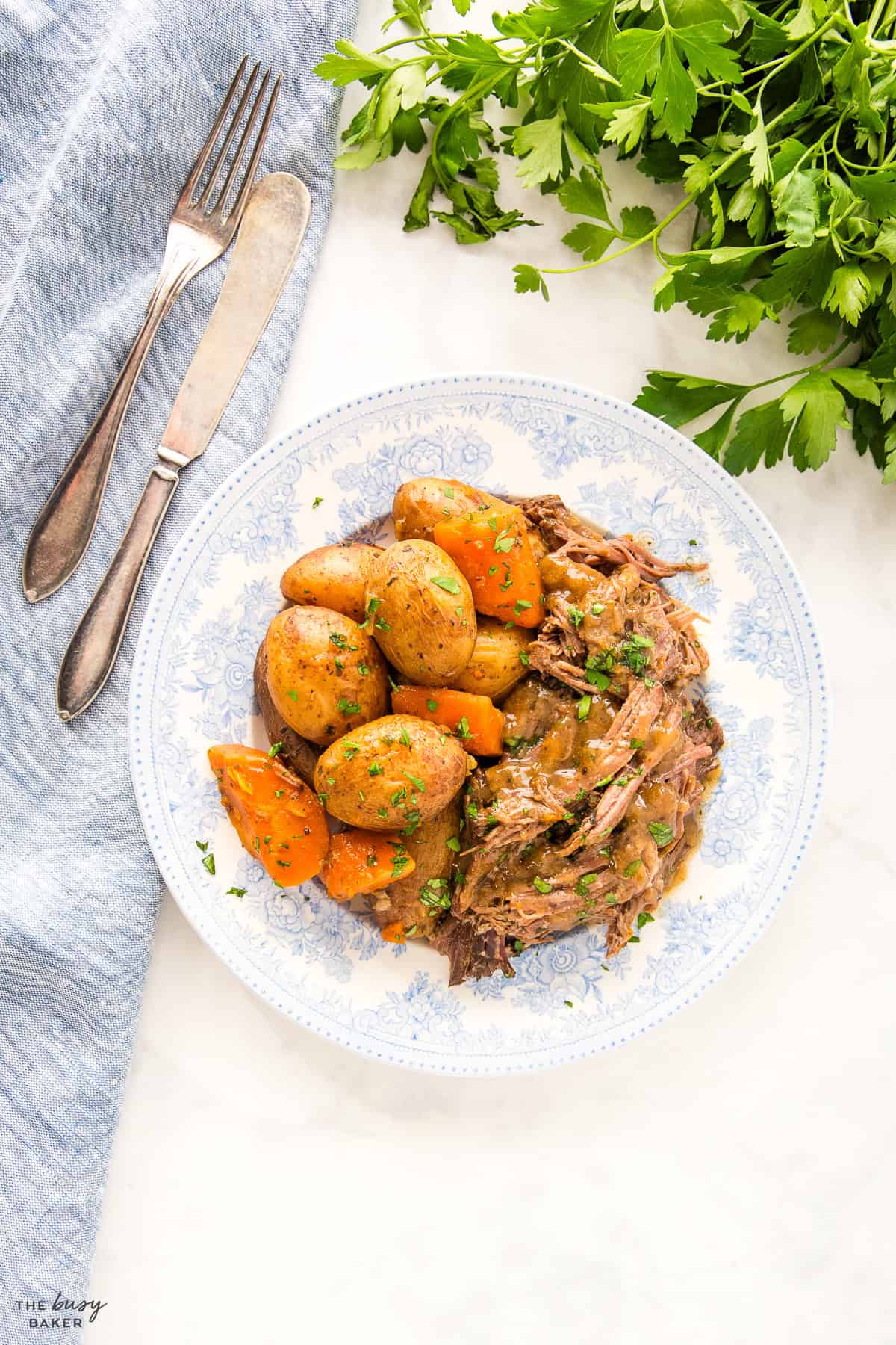 overhead image: Instant Pot Pot Roast with carrots, potatoes and gravy