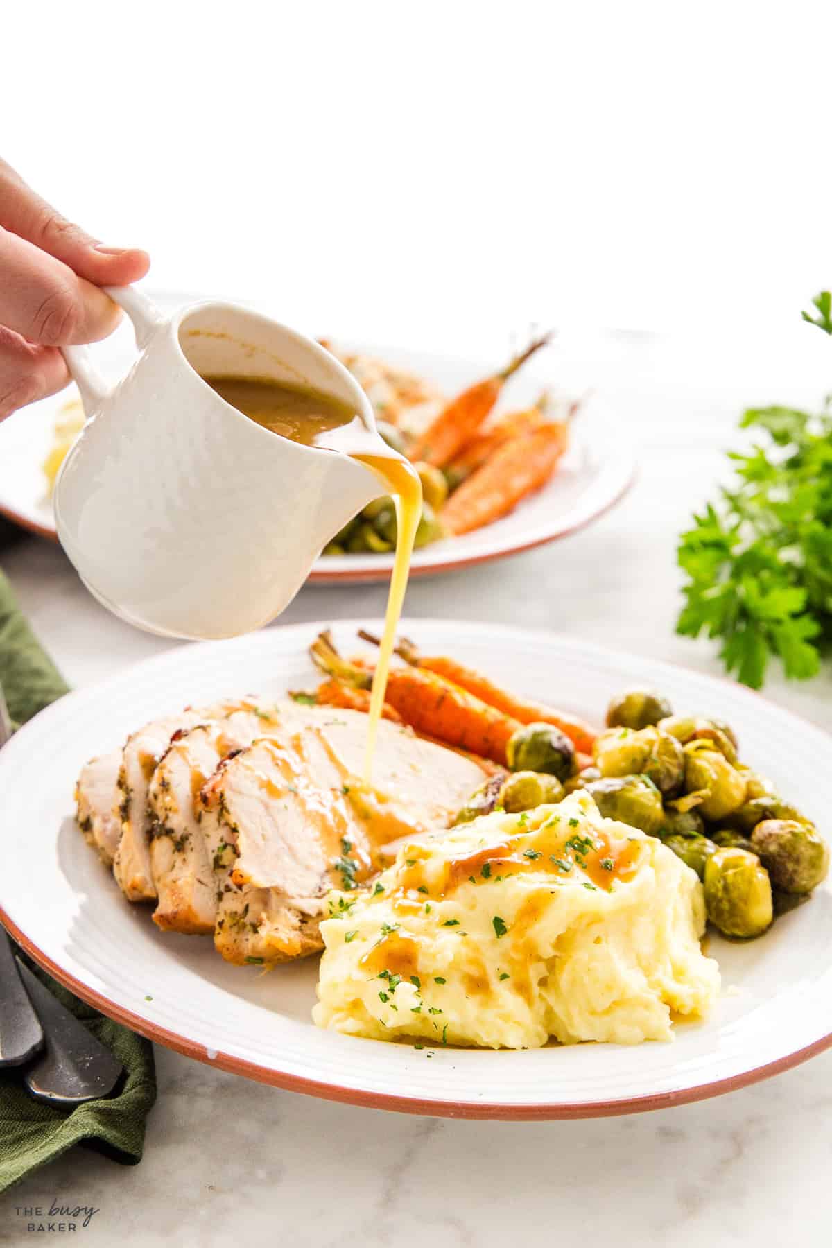 gravy pouring over turkey dinner