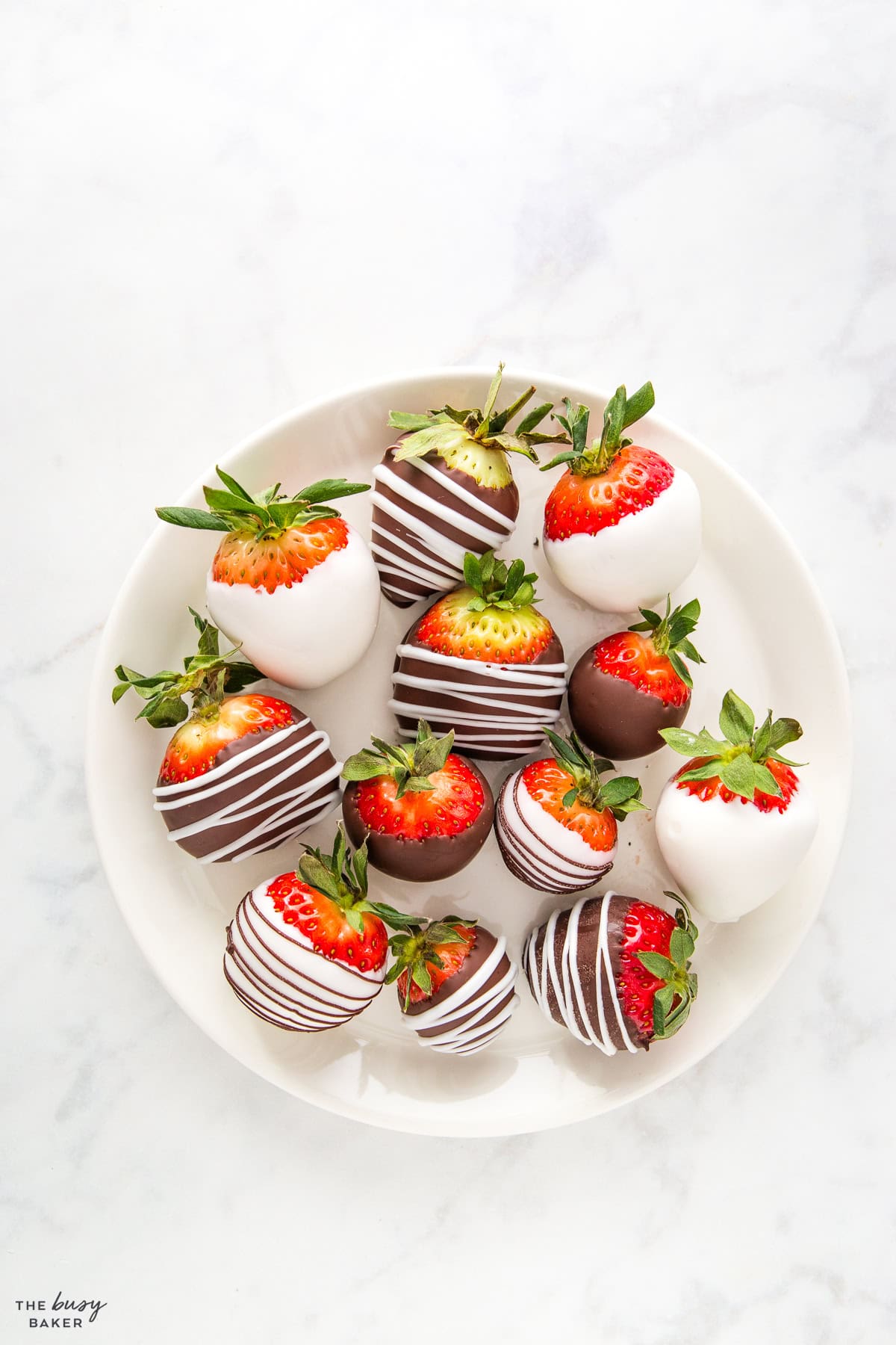 chocolate covered strawberries on a white plate