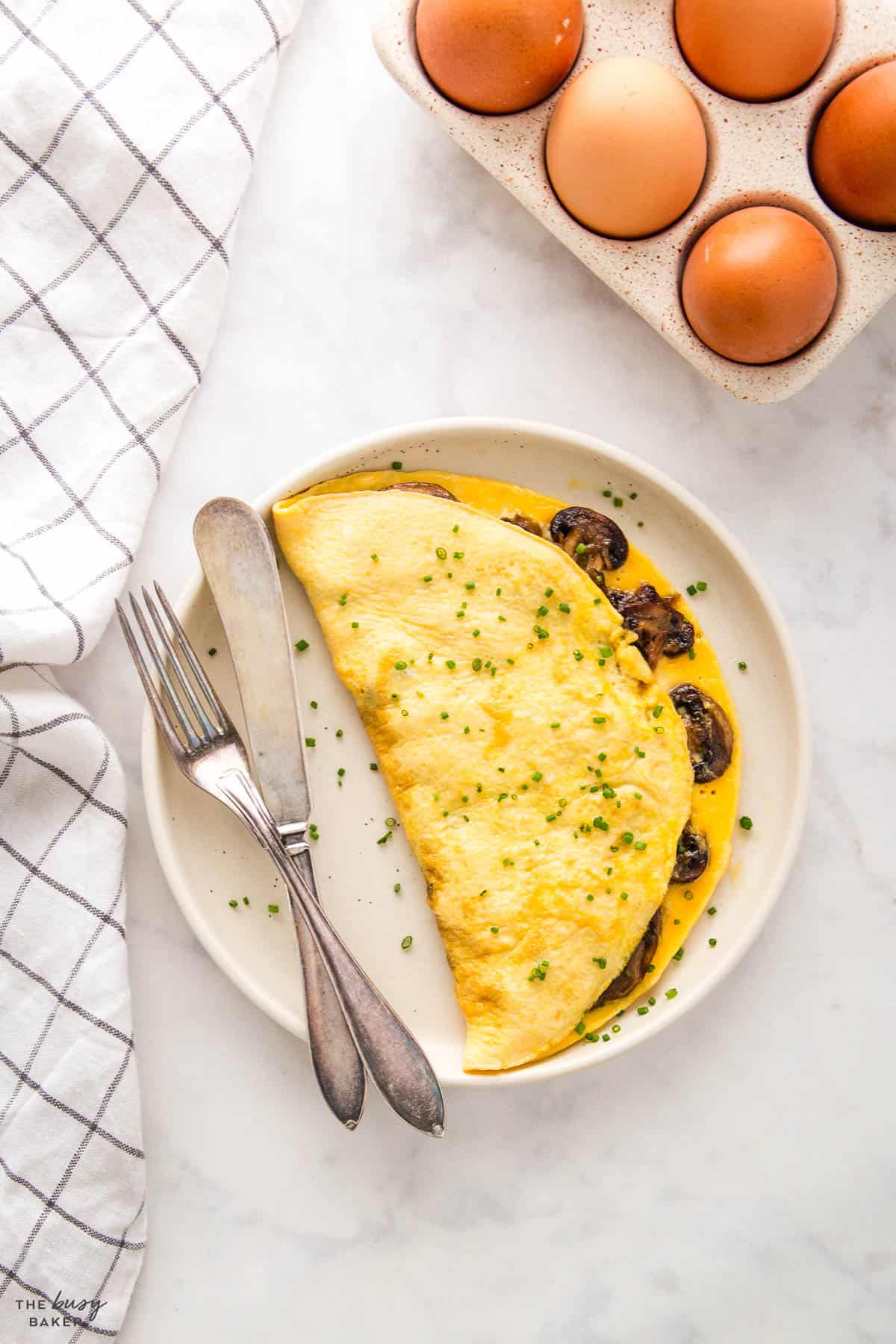 mushroom omelette on white plate