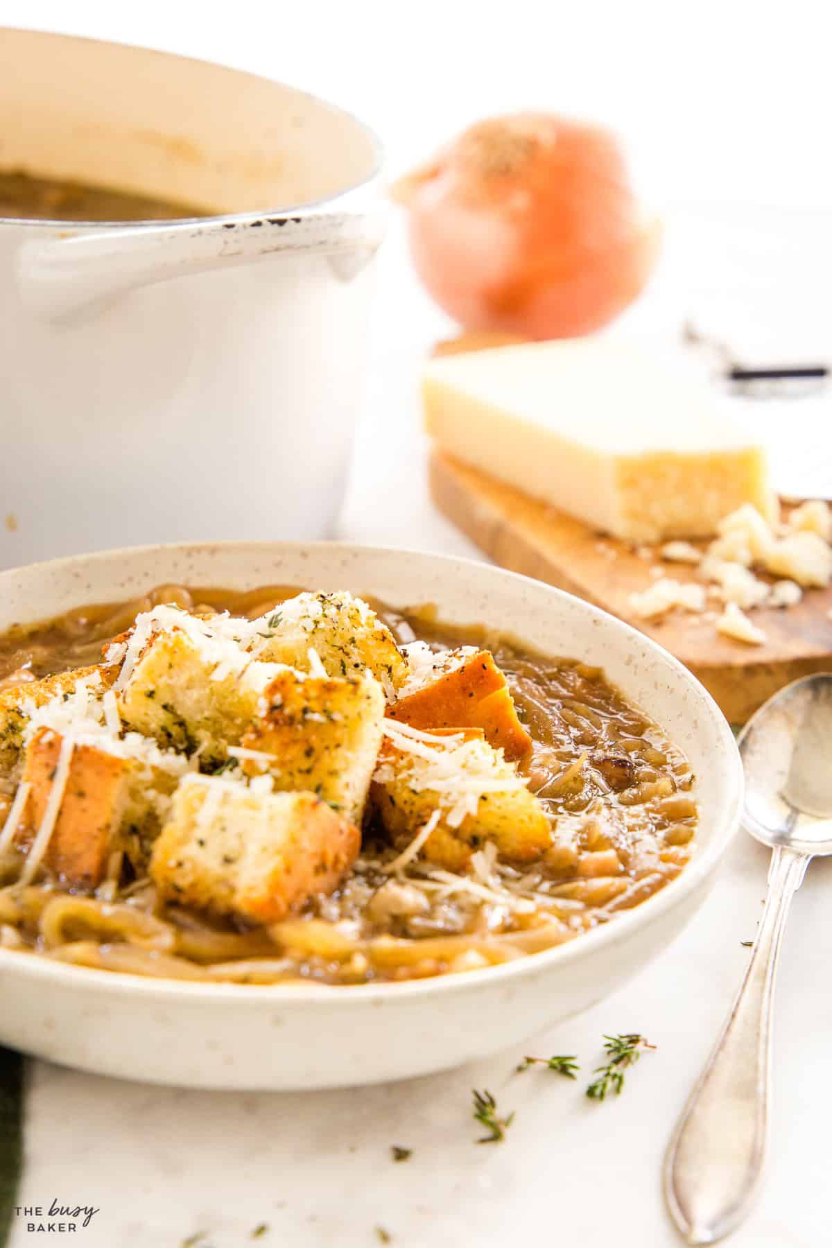 bowl of stew with croutons and cheese