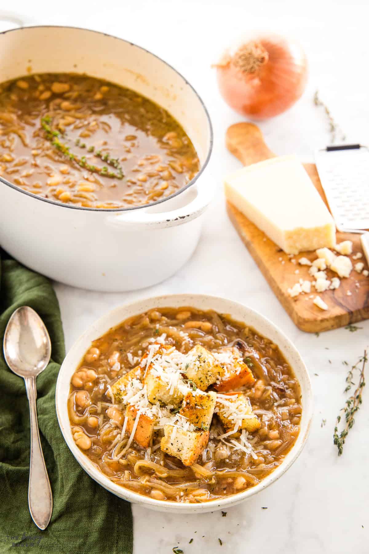 pot of white bean soup with onion