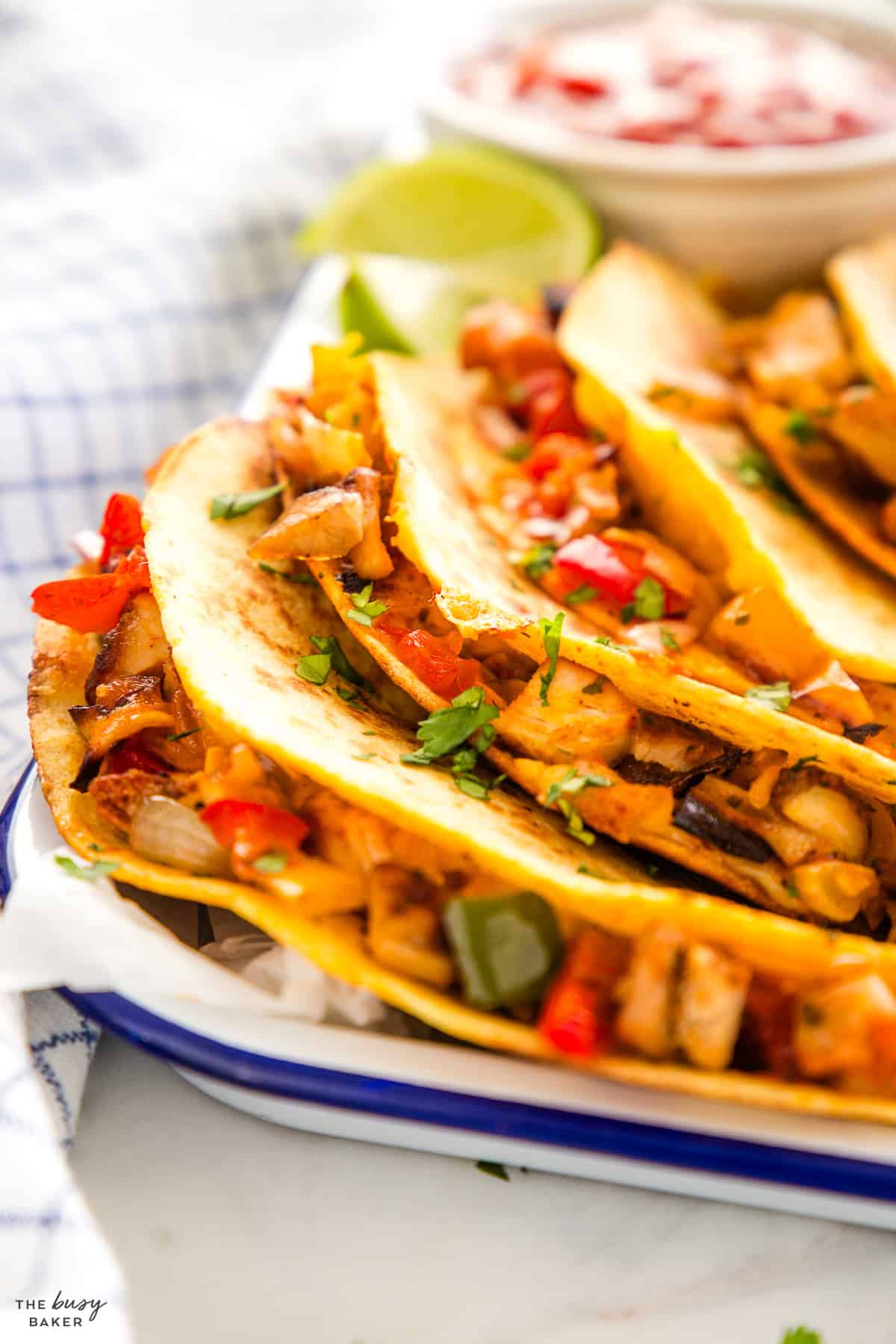 how to make quesadillas - on a platter with chicken and peppers